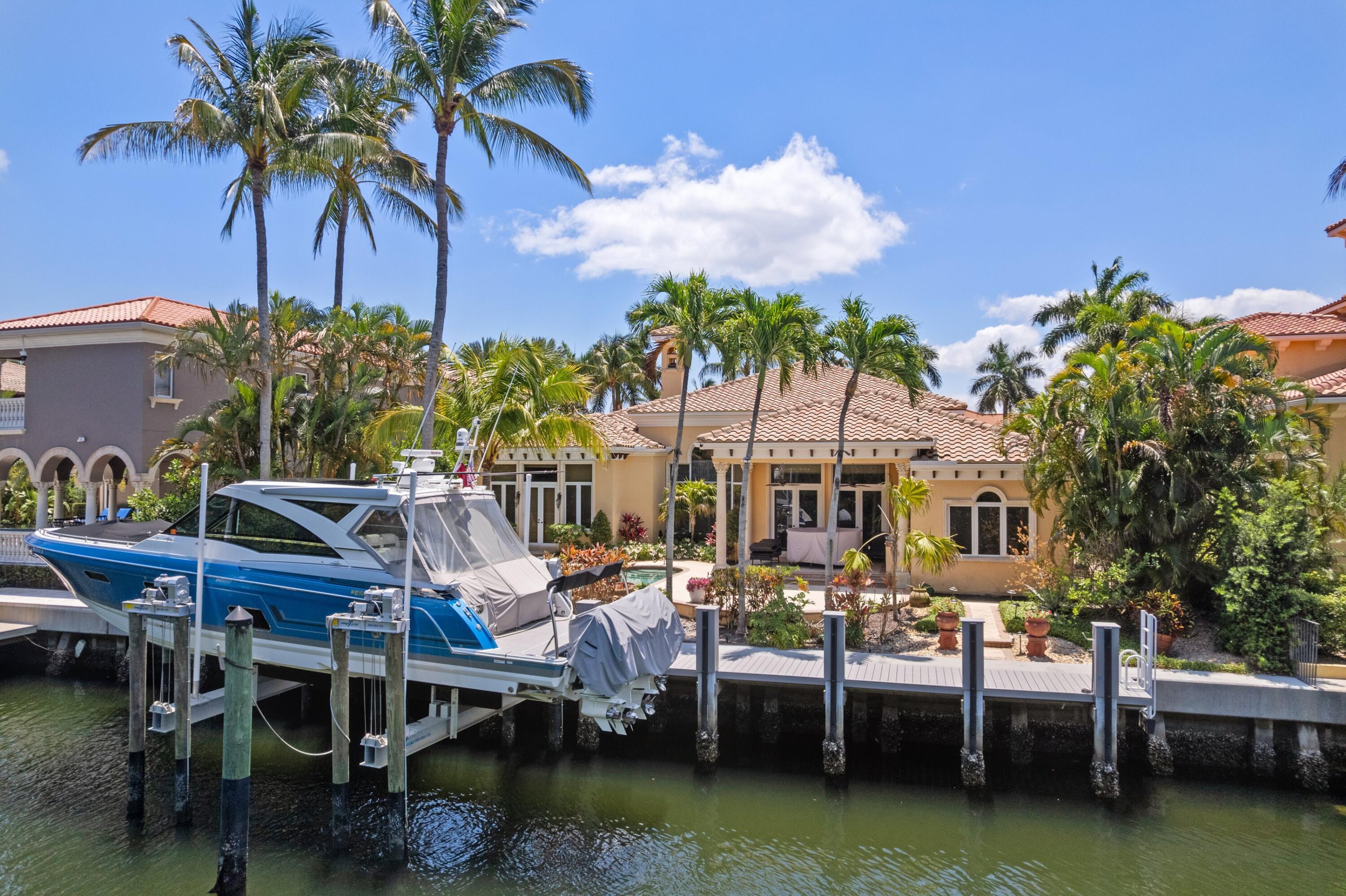 Positioned behind the gates of Harbour Isles, this stunning single story waterfront estate delivers the ultimate South Florida boating lifestyle. A newly updated private dock and brand new 40,000 lb boat lift set the tone for serious boaters. Spanning 3,848 sq ft, the 4 bedroom, 5 bathroom CBS home features soaring ceilings, a three way split layout, gas cooktop, marble flooring, and a private pool and spa. A 3 car garage, natural gas systems, and zoned HVAC complete the package. Minutes from world class dining, shopping, and the beaches of Juno and Jupiter. Waterfront living at its finest.