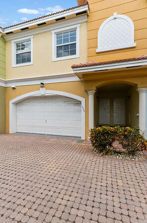 Villa "Escondida" means tucked away or hidden. This townhome is an Estate Sale turn key listing with all furnishings, accessories & art work included just as you see it at showing. A small community of 12, two story homes on a paver street gated at one end makes for private & quant community.  3 bedrooms, 2 & 1/2 baths with open floorplan, granite counter tops & SS appliances. Split bedrooms & large primary bedroom w/ 2 lg walk-in closets, a balcony & lg walk-in shower. Tall ceilings thru-out & a private fenced backyard & patio w/room for a plunge pool as others in the community already have. A 2 car garage set up with a fast EV charger & home water filter system. Just one block from Sprouts Farmers Mkt, Scandles & Close shopping & Wilton Dr. nightlife.