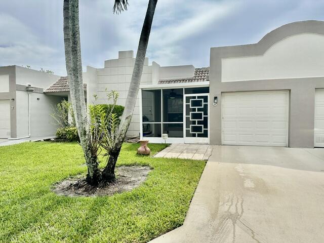 Magnificient  2/2 Villa, 1 car garage, Front Patio,Unfurnished,  NEW updated open kitchen, quartz counter and backsplash, extra cabinets where you can have stools, all tile except master bedroom has wood look floor, impact windows in living area and master bedroom, both bathrooms are updated, new blinds in living area. Short walk to active clubhouse with heated pool, tennis and bocce courts, game and exercise rooms,etc.. Close to shopping,restaurants,and entertainment. This magnificent home is a must see !