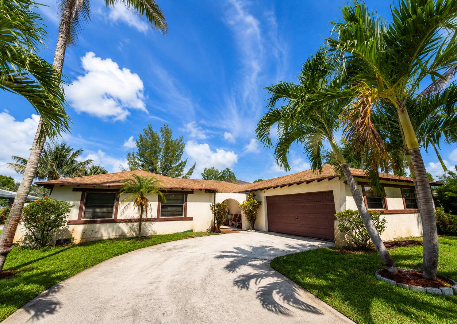 PRICED BELOW MARKET—this exceptional opportunity won't last long. This charming single-story home offers incredible potential for buyers/ investors with vision. Situated on a corner lot with low HOA fees, this established community provides convenient access to I-95, Turnpike, shopping, dining, and all essential amenities.  The home features 3 bedrooms 2 bath and a two-car garage. Property will need a new roof, appliances and A/C and is priced below market with those factors in mind. Lots of yard space for all your fruit trees!
