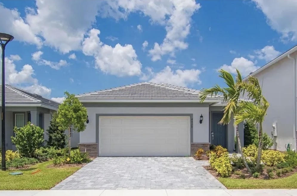 Welcome to 4520 Jolly Roger Manor, a beautifully maintained, brand-new 3-bedroom, 2-bath home located in the sought-after Harbor Isle community. This bright and open floor plan features a spacious kitchen, comfortable living areas, and modern finishes throughout. Enjoy a screened patio, 2-car garage, and the convenience of water and landscaping included. Residents have access to resort-style amenities including a community pool, fitness center, pickleball courts, walking trails, and scenic lake views. Located just minutes from Wabasso Beach, the Indian River Lagoon, dining, shopping, and golf courses, this home offers the perfect blend of coastal living and everyday convenience. Pet-friendly and move-in ready.