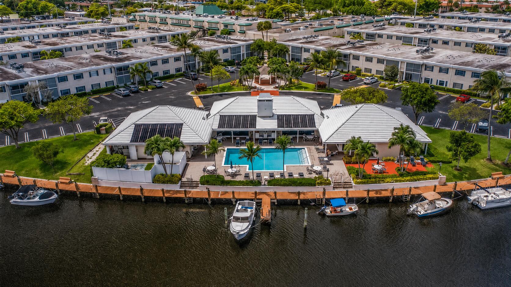 Welcome to this 1-bedroom, 1.5-bath corner unit at Cypress Club in Pompano Beach. Featuring wood grain tile flooring and modern upgrades throughout. The full bathroom features a waterfall showerhead and hose for a luxurious feel. Half bathroom wall is shiplapped to add a coastal touch. Lighting has been updated throughout. The kitchen has stainless steel appliances with a brand new fridge. Unit is conveniently located steps from the laundry room and trash, with a deep walk-in storage closet under the stairs. Cypress Club is all-ages and sits right on the water with direct ocean access, and boat slips are available to rent annually. The McNab Bridge is currently being raised to accommodate larger vessels, enhance safety, and boost long-term property value with completion expected in September. Your unit comes with 1 parking spot in front, plenty of guest spots available. No upcoming assessments! The building has completed its 40-year recertification with concrete restoration, fresh exterior paint, updated patios, and a new roof completed in 2024. Resort-style amenities include a heated pool, full kitchen, grills, gym, sauna, community room, and billiard room. One pet welcome under 15 lbs. HOA paid quarterly at $1,452. Conventional, FHA, and VA loans approved! Owners may rent after 2 years. 700 credit score required. Same-day showings available.