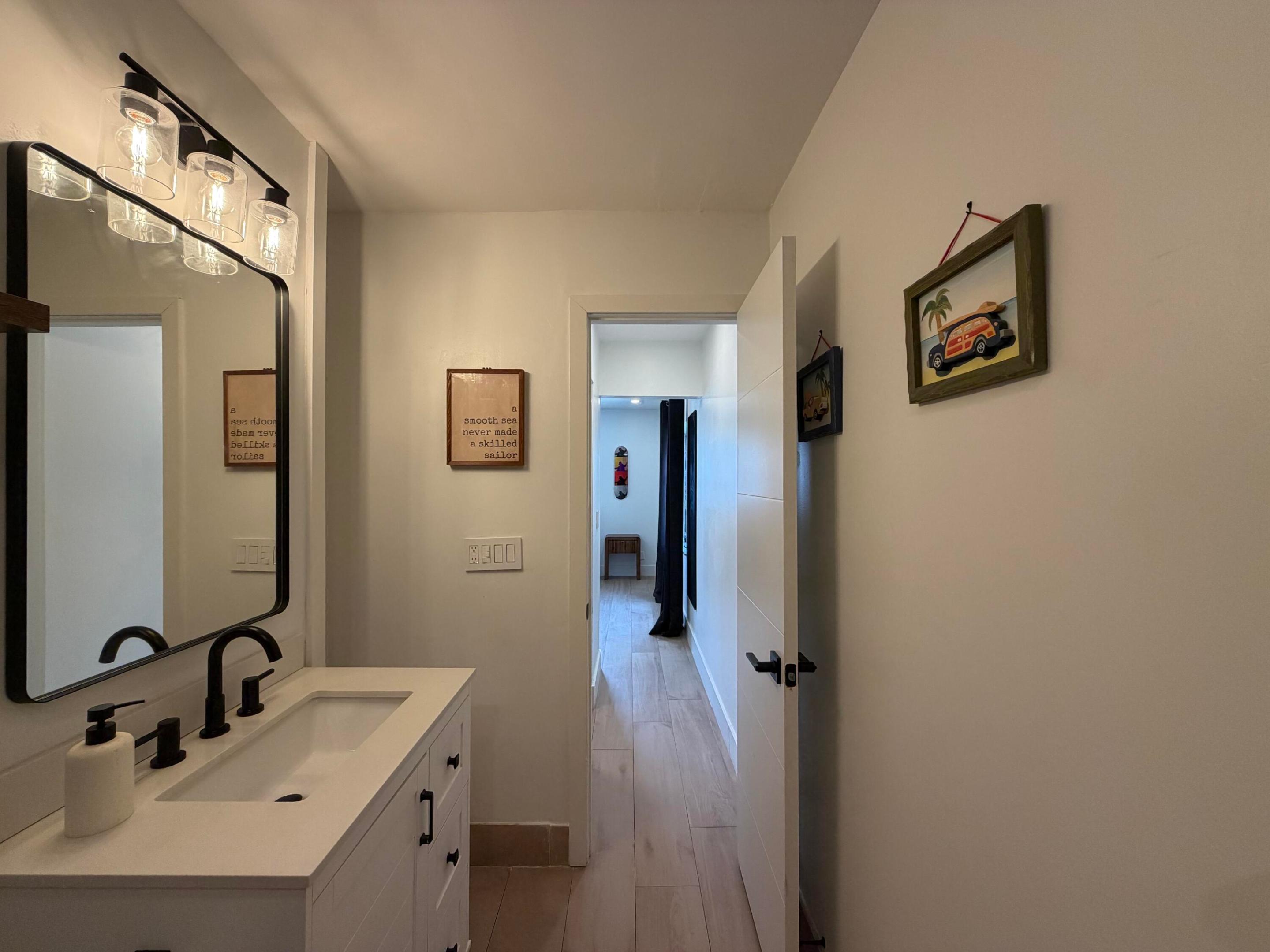Welcome to this 1-bedroom, 1.5-bath corner unit at Cypress Club in Pompano Beach. Featuring wood grain tile flooring and modern upgrades throughout. The full bathroom features a waterfall showerhead and hose for a luxurious feel. Half bathroom wall is shiplapped to add a coastal touch. Lighting has been updated throughout. The kitchen has stainless steel appliances with a brand new fridge. Unit is conveniently located steps from the laundry room and trash, with a deep walk-in storage closet under the stairs. Cypress Club is all-ages and sits right on the water with direct ocean access, and boat slips are available to rent annually. The McNab Bridge is currently being raised to accommodate larger vessels, enhance safety, and boost long-term property value with completion expected in September. Your unit comes with 1 parking spot in front, plenty of guest spots available. No upcoming assessments! The building has completed its 40-year recertification with concrete restoration, fresh exterior paint, updated patios, and a new roof completed in 2024. Resort-style amenities include a heated pool, full kitchen, grills, gym, sauna, community room, and billiard room. One pet welcome under 15 lbs. HOA paid quarterly at $1,452. Conventional, FHA, and VA loans approved! Owners may rent after 2 years. 700 credit score required. Same-day showings available.