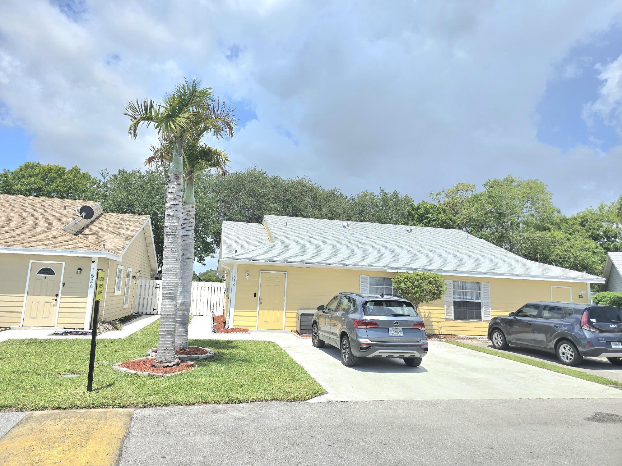 Beautiful, well-maintained property featuring a brand-new roof installed in 2024, new washer and dryer, and a spacious backyard with a beautiful view — perfect for relaxing or entertaining. Located in a quiet townhouse community offering low-maintenance living with HOA-managed common areas and a community pool.  Prime location just 4 minutes from I-95, 2 minutes from Walmart, close to Publix, shopping centers, restaurants, parks, and schools, only 10 minutes from Palm Beach International Airport, and approximately 15 minutes from downtown West Palm Beach. Convenient access to Southern Blvd and major commuter routes makes this home ideal for comfortable everyday living with everything you need nearby.