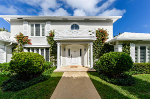 Situated on an elevated large corner lot, this Bahama Lane residence offers all of the luxuries of island living with a serene pool and lush gardens that create the perfect atmosphere for indoor/outdoor living.