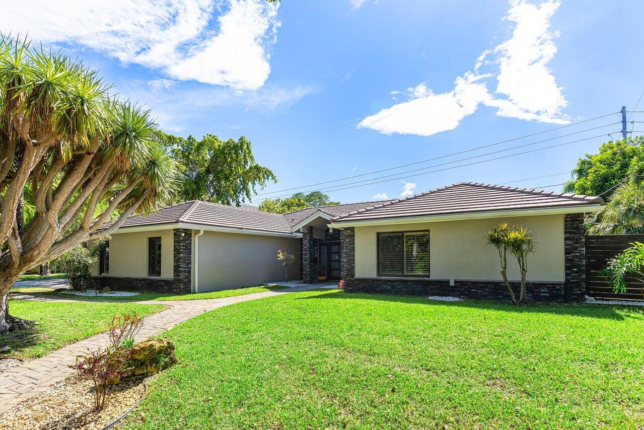 Tucked away in one of North Palm Beach's most highly sought-after coastal pockets, this exceptional residence blends luxury, privacy, and the ultimate South Florida lifestyle. Just steps from Lakeside Park and the Intracoastal, enjoy breathtaking sunrise walks along the water, unmatched tranquility, and a location that truly puts you in the heart of it all. Designed for both comfort and entertaining, the home features a heated pool with electronic shadecasters, hurricane-impact windows and doors, full-home generator, and an extensive exterior and pool remodel complete with elegant new pavers and fencing. Inside, the home showcases a bright, refined atmosphere with thoughtfully designed living spaces and seamless indoor-outdoor flow perfect for everyday living or hosting guests.
