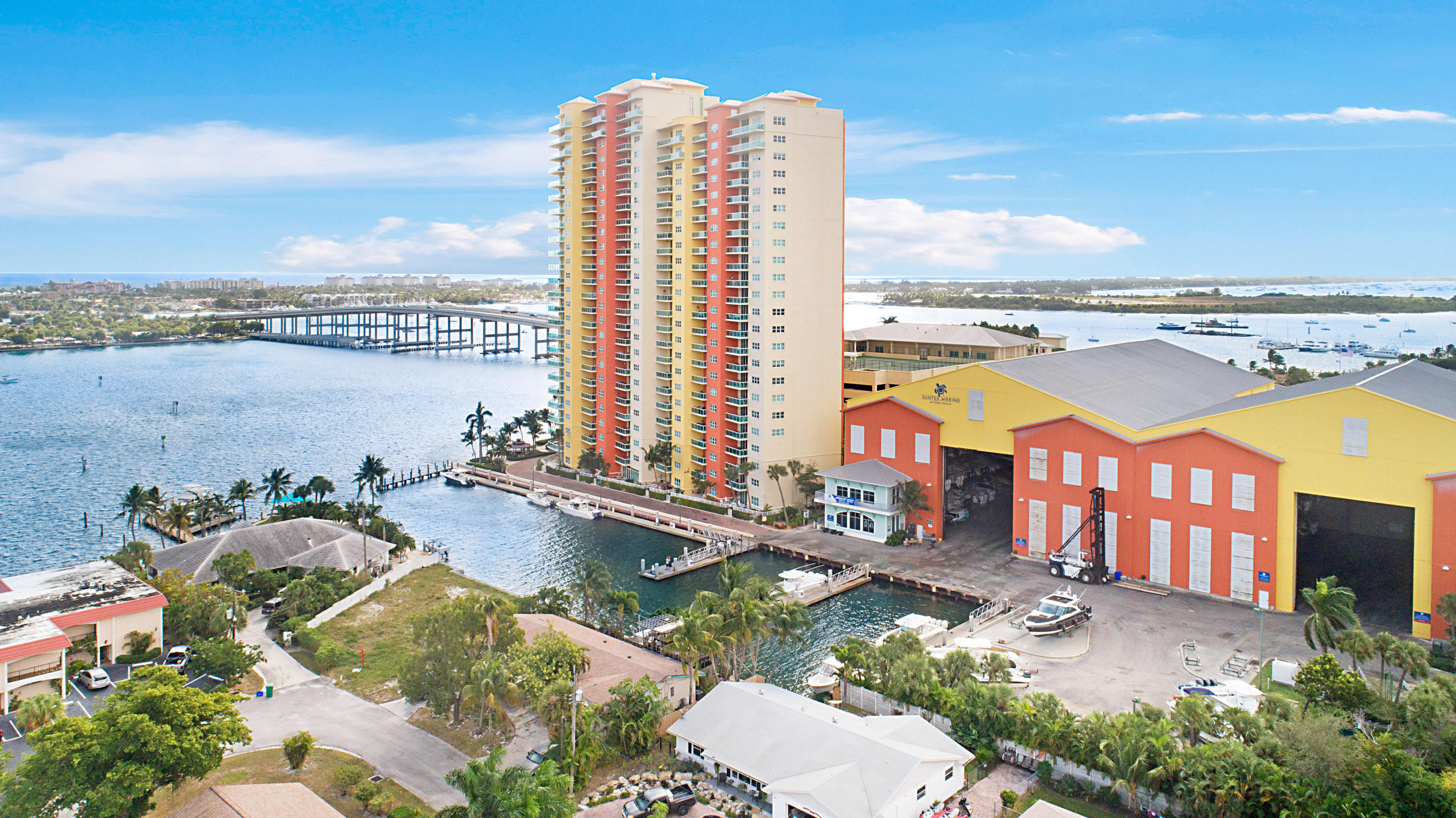 Have you ever envisioned owning a residence with multimillion-dollar, unobstructed waterfront views—without the multimillion-dollar price tag? This is your rare opportunity.Perched on the highly desirable southeast corner of the 14th floor, this exceptional "16 stack" residence at Marina Grande Condominiums offers what is arguably one of the most breathtaking vantage points in all of Palm Beach County. From the moment you enter, you are captivated by sweeping 180-degree panoramic views—stretching south across the Intracoastal from Palm Beach to North Juno Beach, while simultaneously capturing the shimmering turquoise waters of the Atlantic Ocean to the east. Views of this caliber are truly irreplaceable—and impossible to recreate.  • Approximately 1,800 sq ft of interior living space  • Expansive 154 sq ft private balcony ideal for sunrise and evening entertaining  • 3 Bedrooms | 3 Full Bathrooms  • Rare end-unit positioning with additional south-facing windows for enhanced natural light  • Motorized window treatments in the living area  • Updated kitchen featuring:  o New stainless steel appliances  o Double ovens + warming drawer  o Elegant granite countertops  • Full-size new washer & dryer in dedicated laundry room   Residents of Marina Grande enjoy a private, resort-inspired lifestyle with world-class amenities, including: • Newly renovated waterfront pool deck  • Tennis, pickleball & bocce courts  • Expansive state-of-the-art fitness center  • Sauna & steam rooms  • Elegant billiards & card lounges  • 24-hour concierge & security  • Valet services  For boating enthusiasts, a full-service marina just steps away provides effortless access to the Intracoastal and direct ocean entry within minutes—an unparalleled advantage for the South Florida lifestyle.  Ideally situated in the heart of the Palm Beach waterfront corridor: • 5 minutes to the pristine beaches of Singer Island  • Near Phil Foster Park — internationally known for snorkeling and diving  • 15 minutes to the Port of Palm Beach  • 20 minutes to Palm Beach International Airport  • Minutes from the world-renowned luxury of Palm Beach and West Palm Beach, offering fine dining, designer shopping, golf, and cultural attractions  This residence represents a hidden luxury gem under $1 million—an extraordinary value for a corner waterfront condo with irreplaceable views, resort amenities, and premier location.
