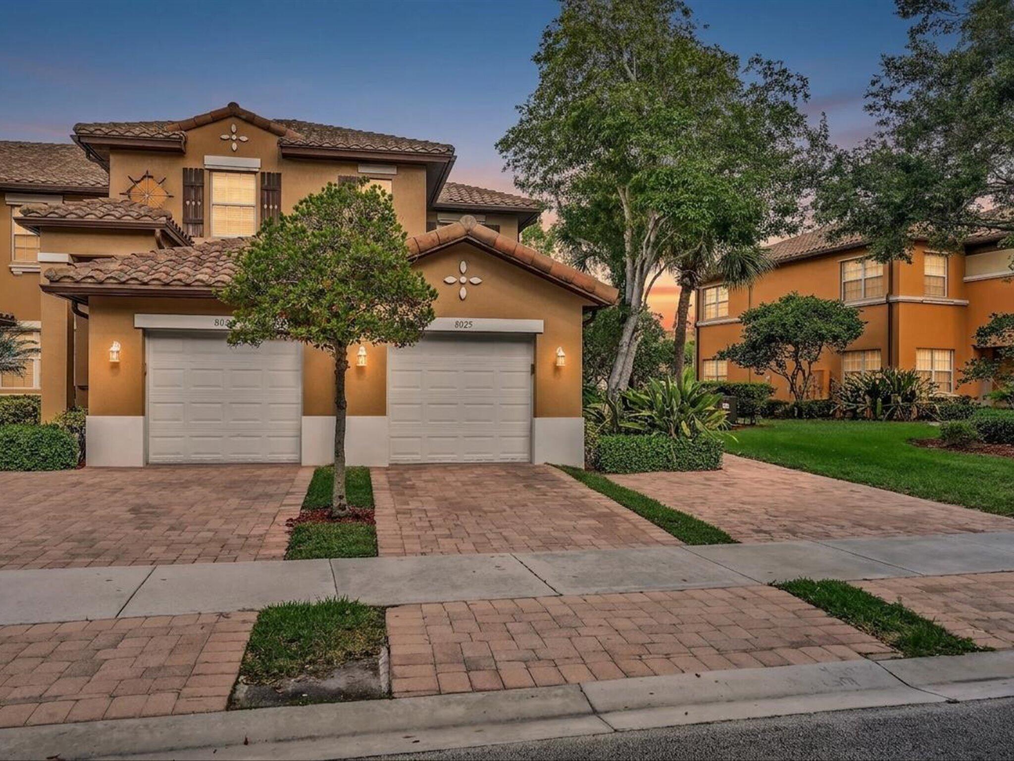 Nestled in the gated community of Heron Bay in Parkland, this corner coach home blends comfort with style. Step inside your foyer to an open layout with tile floors in the main living areas & warm bamboo in the bedrooms. The kitchen draws everyone in with features like wood cabinetry with glass doors, granite counters, 2025 stainless steel appliances, bar seating, & a wine fridge for easy Sundays. The spacious primary offers a walk-in closet & relaxing water views. Enjoy mornings with coffee on your screened patio and evenings with sunset views over the lake. Heron Bay offers two resort-style clubhouses, pools, tennis & pickleball courts, fitness centers with locker rooms and saunas, racquetball & basketball courts, a splash park with tot lot, and so much more for a complete experience.