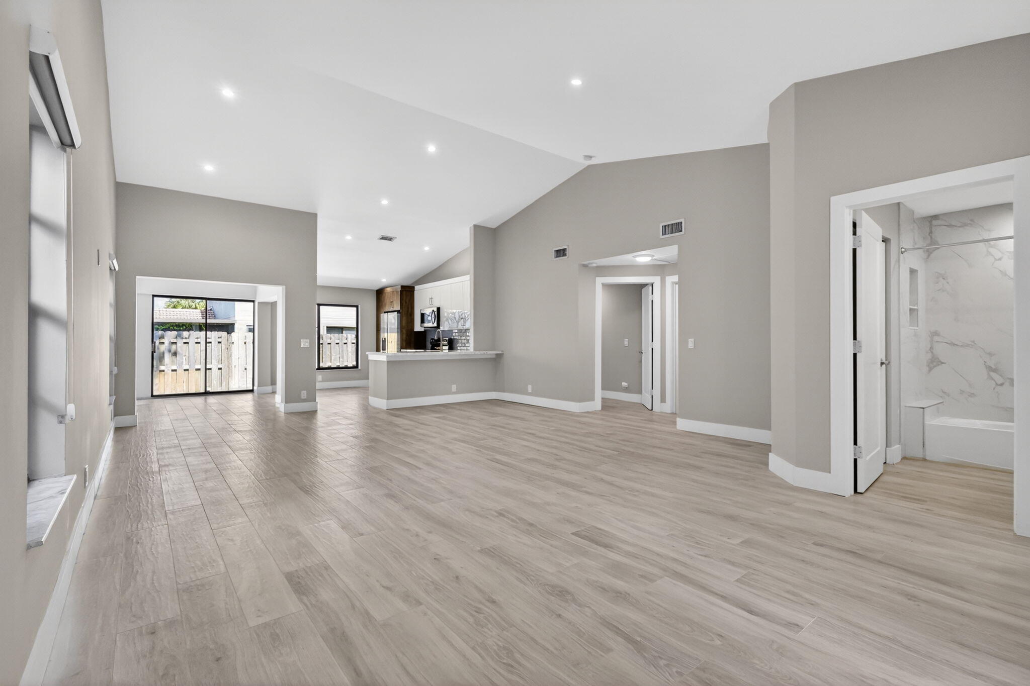 This 1378 ft.², 2 bedroom, 2 bathroom, one story villa is located in the community of Country Fair, centrally located in Boynton Beach. Low HOA fees of $398 get you a gated entry, a pool, 2 tennis courts, and a playground for the kids. The fee includes lawn care, roof maintenance, and exterior painting. The property has a fully fenced in patio, newer A/C (2022), and accordion shutters for peace of mind during hurricane season. It also features a separate dining area. The interior of the villa has updated with wood-look tile flooring throughout. It has an updated kitchen with stone countertops, tile backsplash, and stainless steel appliances.  Both bathrooms have also been updated with stone countertops and tile showers. The master bathroom features his/her sinks.  The unit can be rented right away, and for a minimum of 3 months. 2 pets are allowed, with no weight restrictions.