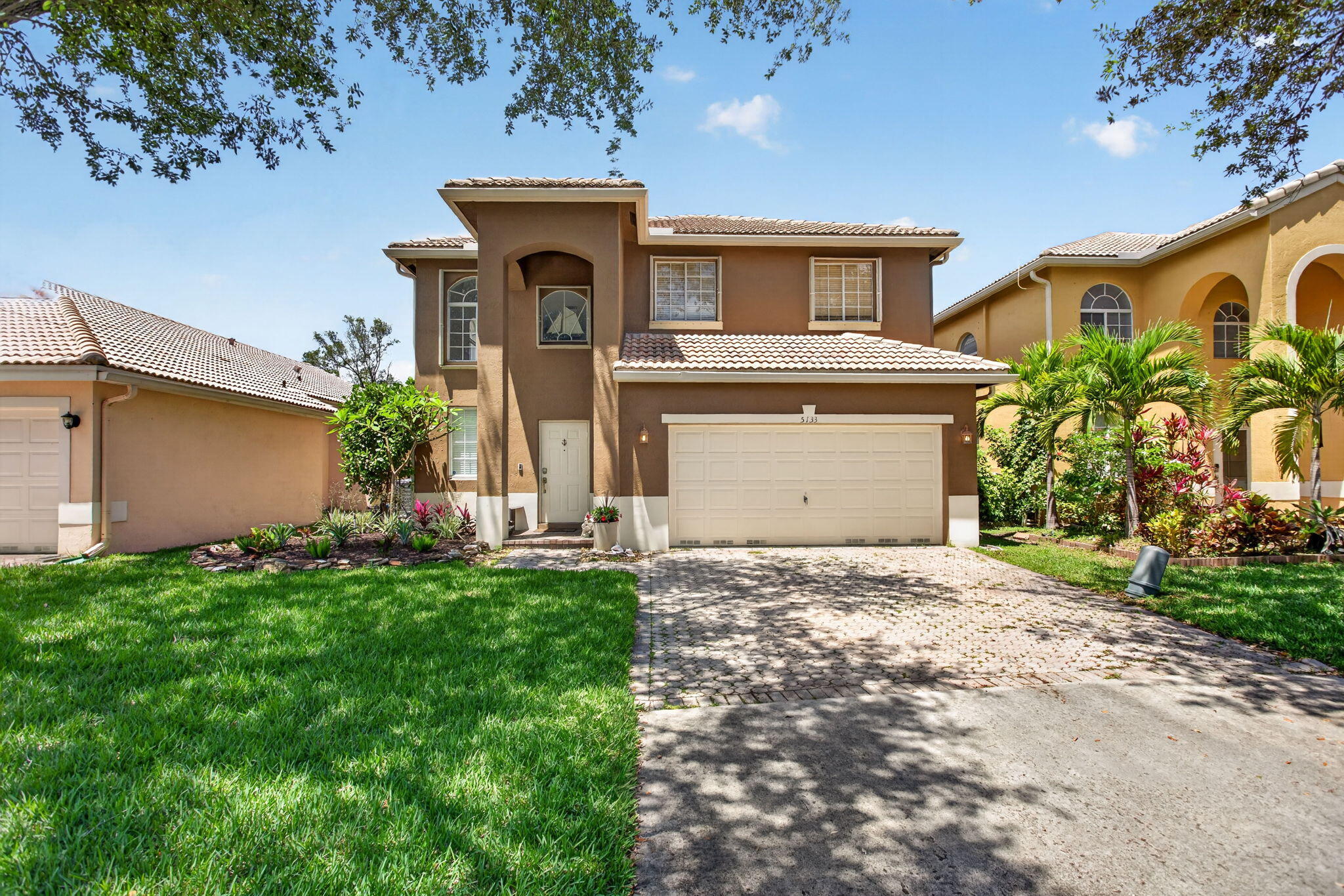 Welcome to this beautifully maintained 3-bedroom, 2.5 bathroom home with a versatile extra room and spacious loft, offering the perfect blend of comfort and functionality. The first floor features tile flooring, while the entire second level showcases elegant bamboo wood floors. The remodeled kitchen is a standout, complete with quartz countertops and an oversized island—ideal for entertaining and everyday living. Both bathrooms have been tastefully updated with quartz finishes. Step outside to a screened patio overlooking a private, beautifully landscaped backyard with plenty of room to add a pool. Additional highlights include accordion shutters on the second floor, and panel shutters on the first floor, a freshly painted exterior, 2022 water heater, and a 2023 A/C system.  The back yard in this house is completely fenced, good for pets! Enjoy resort-style living with an HOA that includes lawn care, high-speed fiber optic internet, and 24-hour manned security. Community amenities feature a pool, spa, fitness center, playground, sand volleyball, basketball, tennis and pickleball courts, plus scenic lakes throughout. Ideally located within walking distance to shopping and dining, and just minutes from the Promenade, major highways, and top conveniences—this home truly has it all.