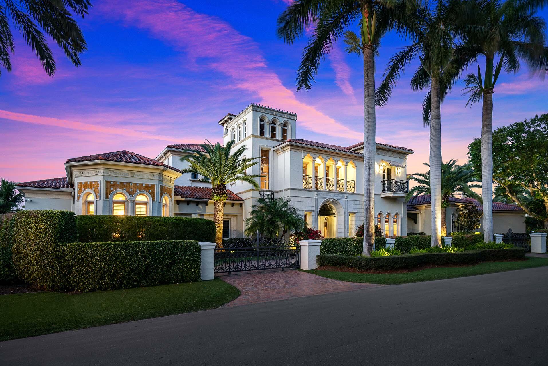 An extraordinary opportunity to own nearly an acre of prime golf course frontage in RPYCC, boasting an impressive 189 feet along the 9th and 18th fairways. 1869 Sabal Palm Drive is a distinguished five-bedroom estate designed for those who appreciate grand-scale living and resort-style amenities. A private, gated motor court welcomes you to this expansive residence, where refined interiors and exceptional outdoor spaces create an unparalleled lifestyle. Indulge in world-class amenities, including a heated resort-style pool and spa, a private sports court, a four-hole putting green, and a fire pit lounge all surrounded by lush, mature landscaping for ultimate seclusion. Inside, marble and rich wood flooring set the stage for sophisticated living. A grand club room with a quartzite bar and private study, a temperature-controlled wine cellar with custom cedar racks, and a lofted gym/bonus room cater to relaxation and entertainment. The first-floor primary suite is a serene retreat with a sitting area, fireplace, His & Her spa-inspired baths, and boutique-style dressing rooms. With four garages, two dedicated golf cart bays, and a location that captures the essence of elite golf course living, this estate presents an unrivaled offering in one of the most coveted enclaves in East Boca Raton.