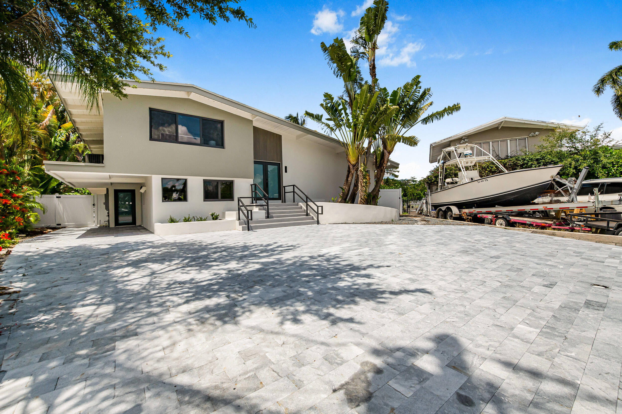 Live the Fort Lauderdale waterfront lifestyle in this fully furnished, turnkey 4BD/3BA on an oversized point lot in coveted Venetian Isles. Completely renovated with brand-new finishes, seamless indoor-outdoor living, and a sun-drenched pool with all-day exposure. 140 FT of frontage, private dock for a 100ft vessel plus a 40ft canal-side, and ocean access with no fixed bridges. Move-in ready — just bring your suitcase. Minutes to Las Olas, downtown, beaches, dining, and private aviation. A rare turnkey waterfront opportunity.
