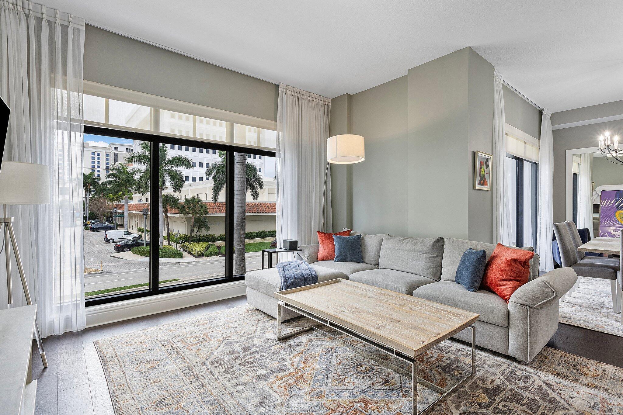 FABULOUS  2-LEVEL, 2 BED/2.1 BATH TOWNHOME LOCATED IN 200 EAST LUXURY RESIDENCES RIGHT IN THE HEART OF DOWNTOWN BOCA RATON... THIS NYC CHIC 2 BEDROOM | 2.1 BATH FEATURES 1,700 SF, 10' CEILINGS, FLOOR TO CEILING WINDOWS & SLIDING DOORS. GLASS STAIR RAILING, RICH DARK WOOD FLOORS, NEW CUSTOM KITCHEN CABINETRY & COUNTERTOPS, WALK-IN PANTRY, CONTEMPORARY BATHROOM VANITIES, BUILT-IN MIELE NESPRESSO COFFEE SYSTEM, SUB ZERO REFRIGERATOR, AND MORE . AN OUTDOOR COVERED BALCONY IS PERFECT FOR UNWINDING AND AN EVENING GLASS OF WINE. COMES WITH (2) ASSIGNED PARKING SPACES & (1) STORAGE UNIT. 200 EAST IS A LUXURY CONDO BUILDING WITH 24/7 FRONT DESK & CONCIERGE & VALET PARKING. AMENITIES INCLUDE A 4TH LEVEL RESORT STYLE SALT WATER POOL/SPA DECK,  SOCIAL/CARD ROOM & EXERCISE ROOM. JUST STEPS TO MIZNER PARK, ROYAL PALM PLAZA, TOP RATED  RESTAURANTS, MARKETS,  OUTDOOR AMPHITHEATER, IPIC AND MORE.