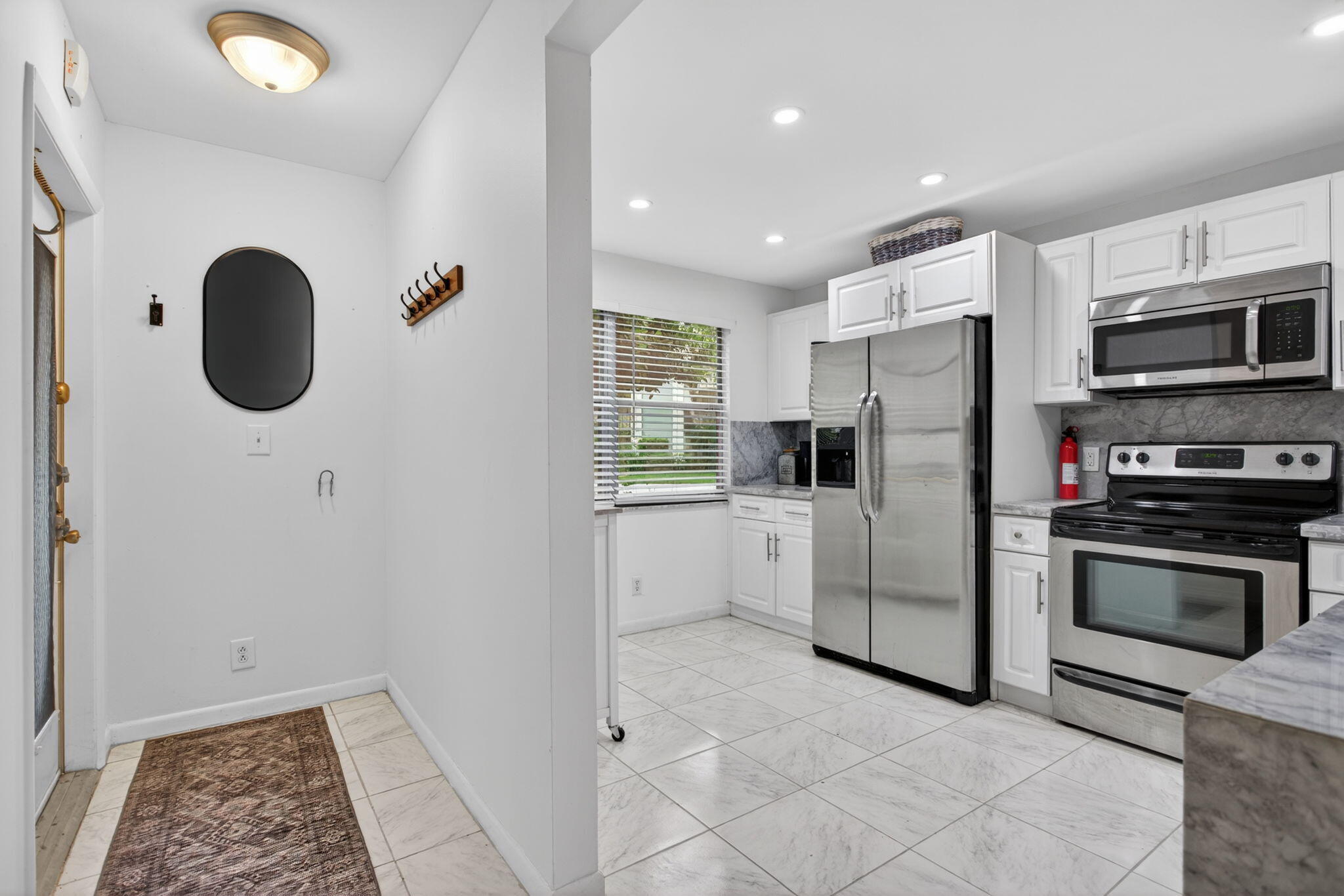 Beautiful corner unit, fully furnished, with a patio enclosure and a private door for an easy stroll to the village pool. Inside, you'll find an updated kitchen, refreshed ceilings, and all tile flooring throughout for a clean, cohesive look. Each bathroom includes its own window, bringing in natural light and added comfort. See all photos then see for yourself. Vacant—park in space #101 or in the Guest Parking.