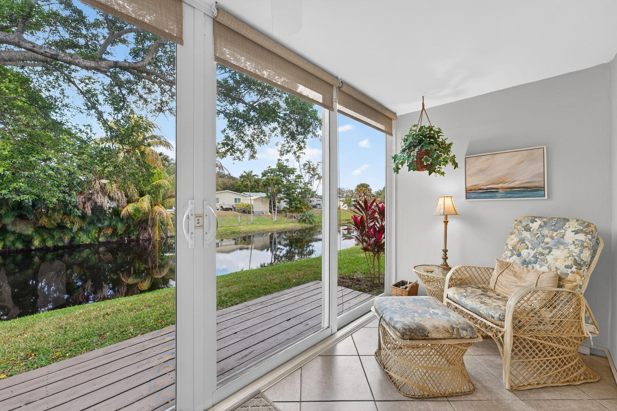 55+ TURN-KEY Tranquil Canal Views and Sunset Skies. Immaculate First Floor Unit has 2 Primary Ensuite's. Beautifully Updated Kitchen and Bathrooms. Extra Clothing & Linen Closets. Shower with Sliding Glass Doors. Enjoy the View from the added Florida Room through the Full Wall of Hurricane Impact Sliding Glass Doors. Canal Water View and Sunset skies  Tile flooring throughout with carpet in the Guest room. Ceiling fans in all rooms. A/C 2018, HWH 2018. Community events include Bingo, Dinner parties, BBQ's and so much more where you get to meet and make new friends. Association requires 20% down & Sec Deposit equal to 6 months assoc. fees held for 18 months. All buyers must meet the required $40k income and 700+ CS   NO Renting Please see attachments in the MLS Listing and use them when submitting an offer. Thank you.