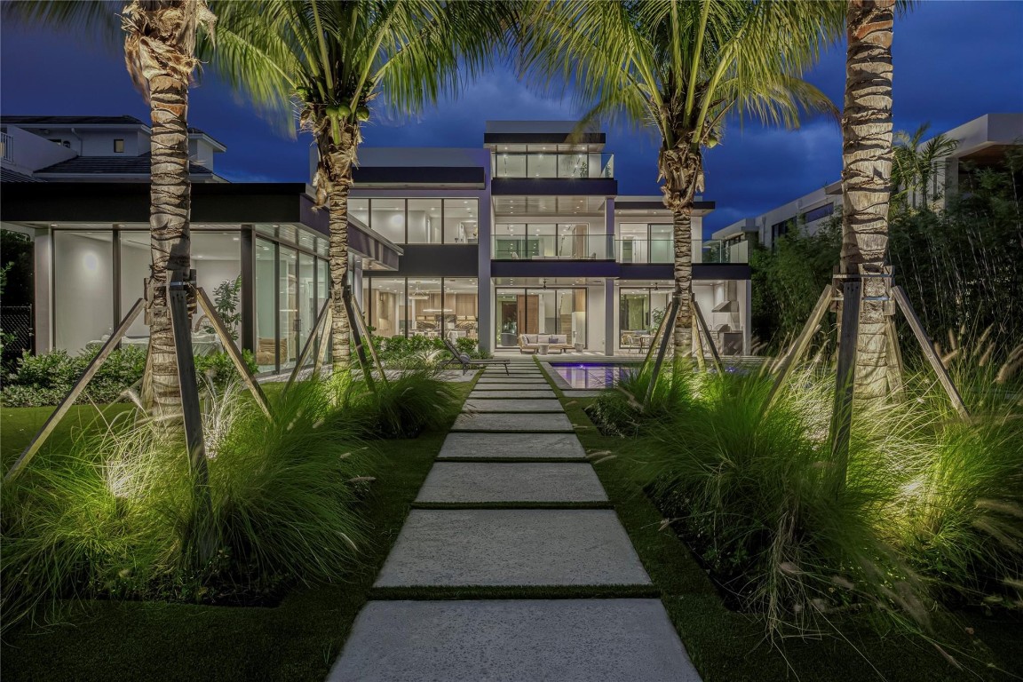 Why have another house looking into your backyard? This newly completed waterfront residence by Gulf Building offers rare privacy on a quiet boutique street where kids can run and play. Set on a 14,443 sq. ft. lot with a wide waterway view and lush park-like feel, the home features a 3-level design plus a separate pool pavilion ideal for an office, gym, or guest suite. Enjoy seamless indoor-outdoor living with covered terraces, a summer kitchen, and a resort-style pool. Close to Las Olas and Anne Beck Park, this home blends luxury, privacy, and family-friendly living in a truly special setting.