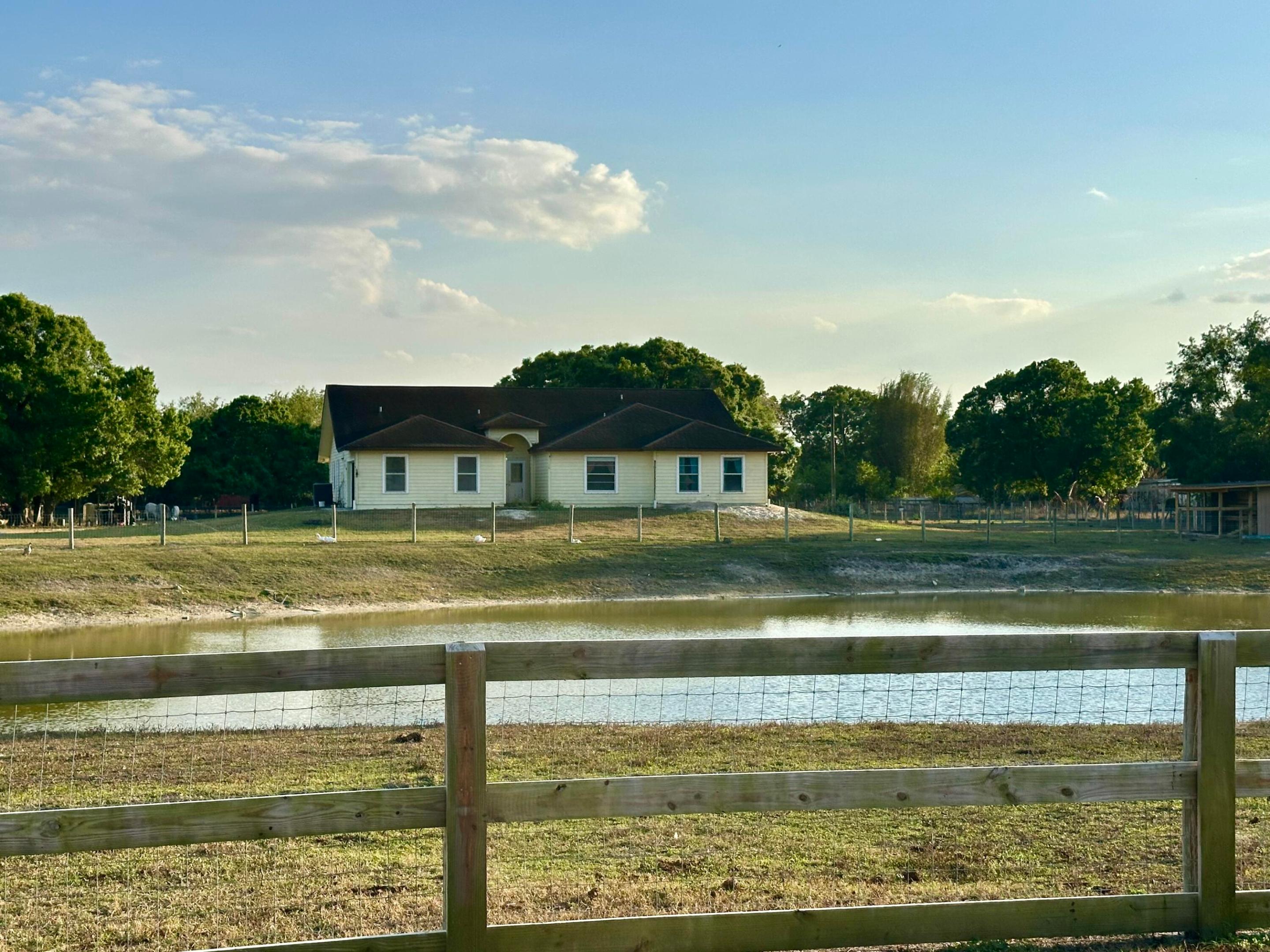 Large Spacious Pool Home on Five Acres in Equestrian Community. Fenced and cross fenced. Large RO water treatment system for entire property Large Master bedroom With Beautifull master Shower