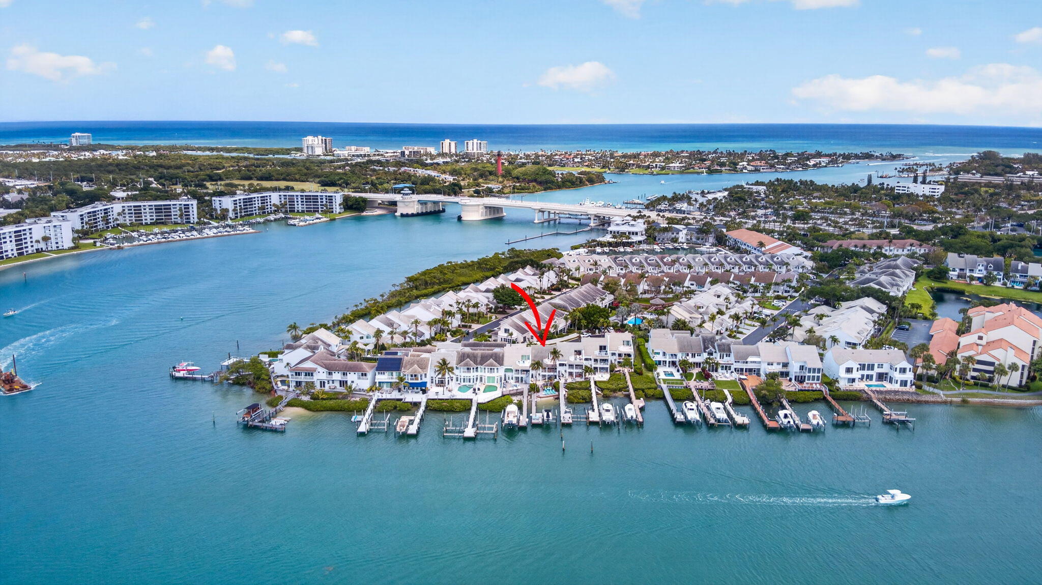 Rare waterfront opportunity in Jupiter Harbor with direct Intracoastal, ocean access & no fixed bridges, just minutes to the Jupiter Inlet. This beautifully positioned residence offers the ultimate boating lifestyle + a private dock can accommodate 50'+ boat, currently configured w/a 13K lb lift. No mangroves on a private sandy beach ideal for launching kayaks & SUP. The home features two brand new HVAC systems & an elevator servicing 1st & 2nd floors for added convenience. Enjoy spectacular 3rd floor views w/breathtaking sunsets, capturing expansive water vistas &  Jupiter's coastal skyline.  Ideally located near Love Street, you're walking distance from premier waterfront dining & entertainment including 1000 North, Square Grouper, Guanabanas. Close to dog friendly Jupiter beaches.