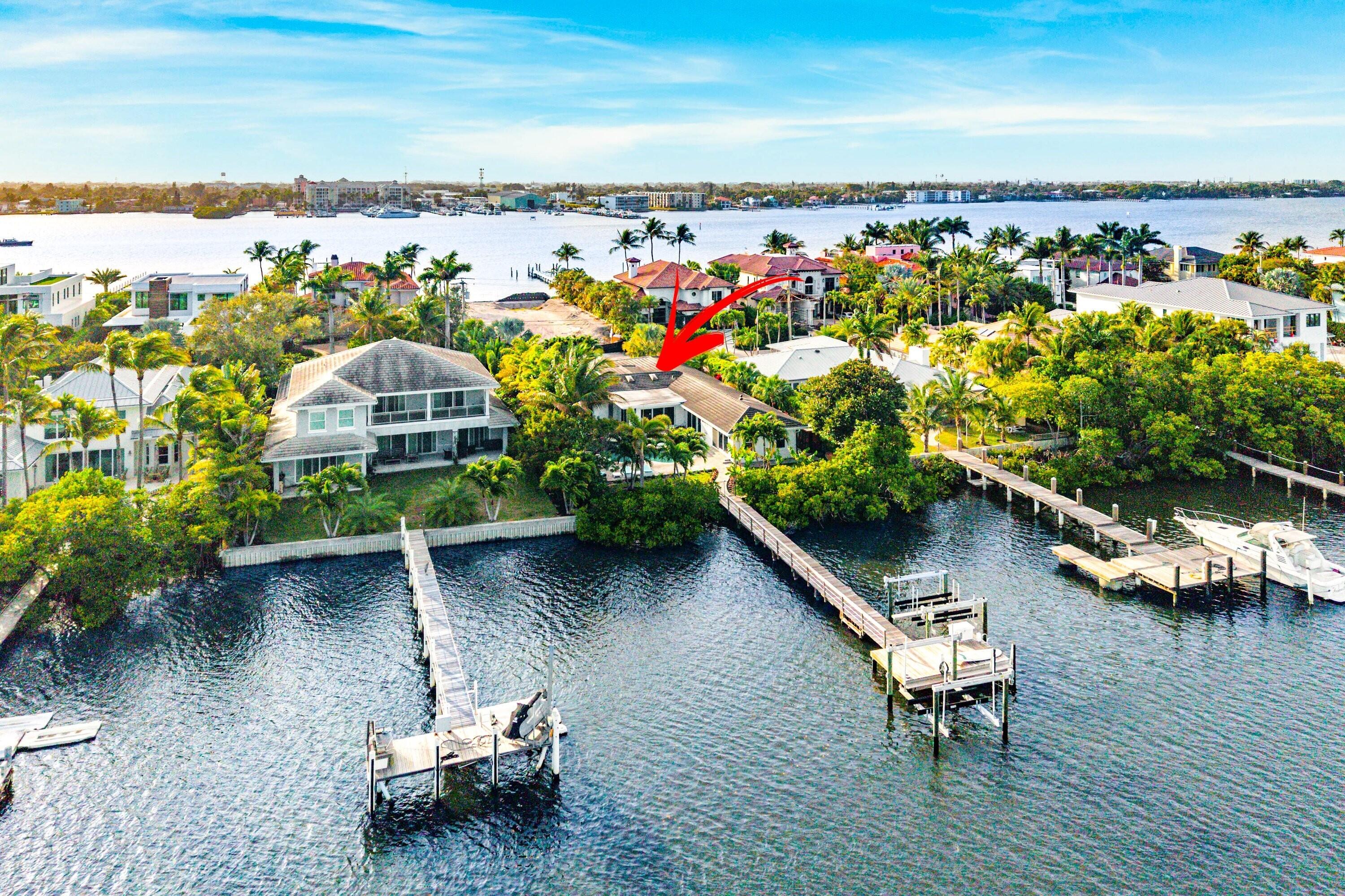 Waterfront luxury meets modern island living on exclusive Hypoluxo Island -- one of South Florida's most coveted and fast-appreciating coastal enclaves.  Ideally positioned between Palm Beach and Manalapan, and minutes to the beach along scenic A1A, this private island community of just 315 single-family homes offers unmatched privacy, prestige, and convenience. This fully renovated 4-bedroom, 2.5-bath waterfront residence spans 2,726 SF and is designed for effortless one-story living. Vaulted ceilings, impact windows, and upgraded 4x4 porcelain floors complement expansive open living spaces filled with natural light and stunning water views. The redesigned chef's kitchen features Miele appliances, a gas stove, and an integrated espresso machine. The primary suite showcases spa-inspired finishes, custom closets, and tranquil pool views.

Outdoor living is exceptional with a heated saltwater pool, sauna, cold plunge, and expansive entertaining deck surrounded by lush landscaping for total privacy. A new private dock with a 16,000-lb boat lift and jet ski storage offers quick, direct access to the Boynton Beach Inlet and the Atlantic Ocean.

Additional highlights include a whole-home generator, 3-zone A/C, water filtration system, and custom furnishings.

A rare opportunity to own prime waterfront property in one of South Florida's most sought-after island communities -- where lifestyle, location, and long-term value align.