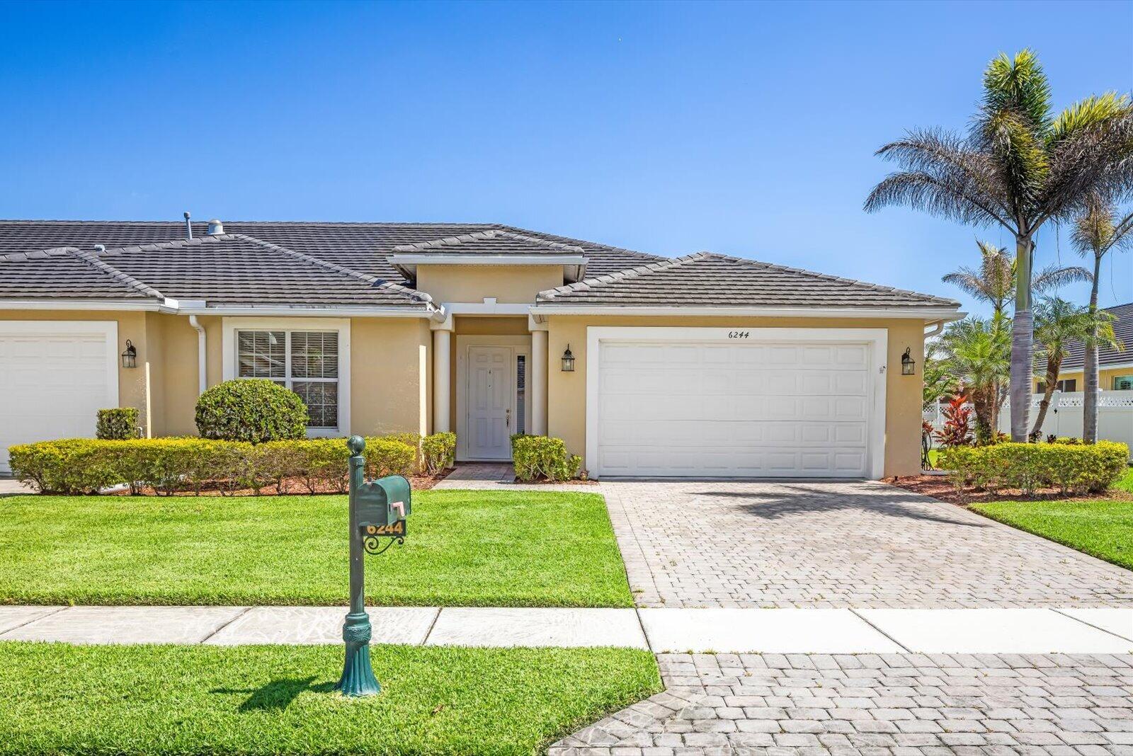 This cute and cozy 3/2 villa is located in the St. Andrew's Park community! This home offers an open-concept kitchen complete with quartz countertops, a breakfast bar, soft-close cabinets and drawers throughout the entire home, and plenty of space to add a kitchen island.  A formal dining room is directly across, giving you ample space to host many dinner parties! The dining room and master bedroom have beautiful tray ceilings, giving you a luxurious feel. The home has large tile flooring throughout the main areas and cozy, carpeted bedrooms. The master suite is very spacious, featuring his & hers walk-in closets, a bathtub, a walk-in shower, and his & hers sinks. A two-car garage with built-in storage is a perfect addition to your home.  This villa is packed with features such as impact windows and doors, wide wheelchair accessible rooms, a laundry room with a utility sink, and a new washer & dryer. Whether it's hosting family and friends or enjoying a night of R&R, the screen lanai offers the perfect place to enjoy the Florida Lifestyle.   The lanai is also fully equipped with additional patio shades to keep you cool on those hot summer days. The spacious backyard has an extended pavered patio that guides you directly to the white picket fence overlooking the pond view. St. Andrew's Park community is gated and monitored 24/7, with a pool, fitness center, and a rentable clubhouse for all of your events! This very sought-after villa is all just a short walk from Saint James Plaza and several golf courses. This property is a great opportunity that you won't want to miss. Come see it for yourself!