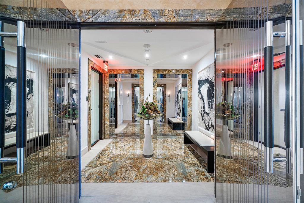 Designed for the connoisseur of fine architecture, this one-of-a-kind masterpiece was artfully designed by world renowned Alfred Karram Jr. with the most superb quality and workmanship at every turn. A private elevator entry opens to dramatic, unobstructed water views as far as the eye can see. Featuring over 5,200 sq/ft, including 4 bedroom suites, Family Room, Grand Living & Entertaining Spaces, this Residence details hand-selected Italian striped Masassar Ebony wood paneling, Juperana granite flooring, artfully fabricated into angled forms and complimented by a custom-crafted layered ceiling soffit system, which mirrors the beveled edge seams of the stone flooring, complete with premium limestone baseboards and borders finished with Â¾'' beveled edges.  See Addendum for More Details. Designed for the connoisseur of fine architecture, this one-of-a-kind masterpiece was artfully designed by world renowned Alfred Karram Jr. with the most superb quality and workmanship at every turn. A private elevator entry opens to dramatic water views, and features specialty polished & etched stainless steel entry doors with premium Napa leather handles. Featuring over 5,200 sq/ft, including 4 bedroom suites, Family Room, Grand Living and Entertaining Spaces, this Residence details hand-selected Italian striped Masassar Ebony wood paneling, Juperana granite flooring, artfully fabricated into angled forms, installed in book matched and vein matched patterns complimented by a custom-crafted layered ceiling soffit system, which mirrors the beveled edge seams of the stone flooring, complete with premium limestone baseboards and borders finished with ¾" beveled edges.  To the highest standards of the most discerning epicurean, the lavish Kitchen includes custom Snaidero cabinetry, a complete Miele appliance package and superb custom configured cutlery inserts sure to impress even Michelin star chef!  The sumptuous Grand Master Suite presents a layered wall system encompassing a Poltrona Frau bed upholstered in premium Napa leather and wide plank oak flooring; His & Her private bathrooms with horizontally cut Honey onyx countertops & mitered edge details, custom Italian cabinetry set atop brushed stainless steel legs, as well as a whirlpool tub and steam shower; and His & Her separate custom-configured Porada Italian glass Closet Systems with opaque and frosted floor-to-ceiling glass doors, and an integrated vanity area. Throughout this magnificent residence are custom designed European frameless glass doors, with premium stainless steel and aluminum hardware.  Residence 303S embraces grace and splendor and is undoubtedly one of the finest luxury condominiums in Boca Raton. Mizner Grand is a full service building on the secure gated grounds of the famed Boca Raton Resort & Club, a Waldorf Astoria Resort.