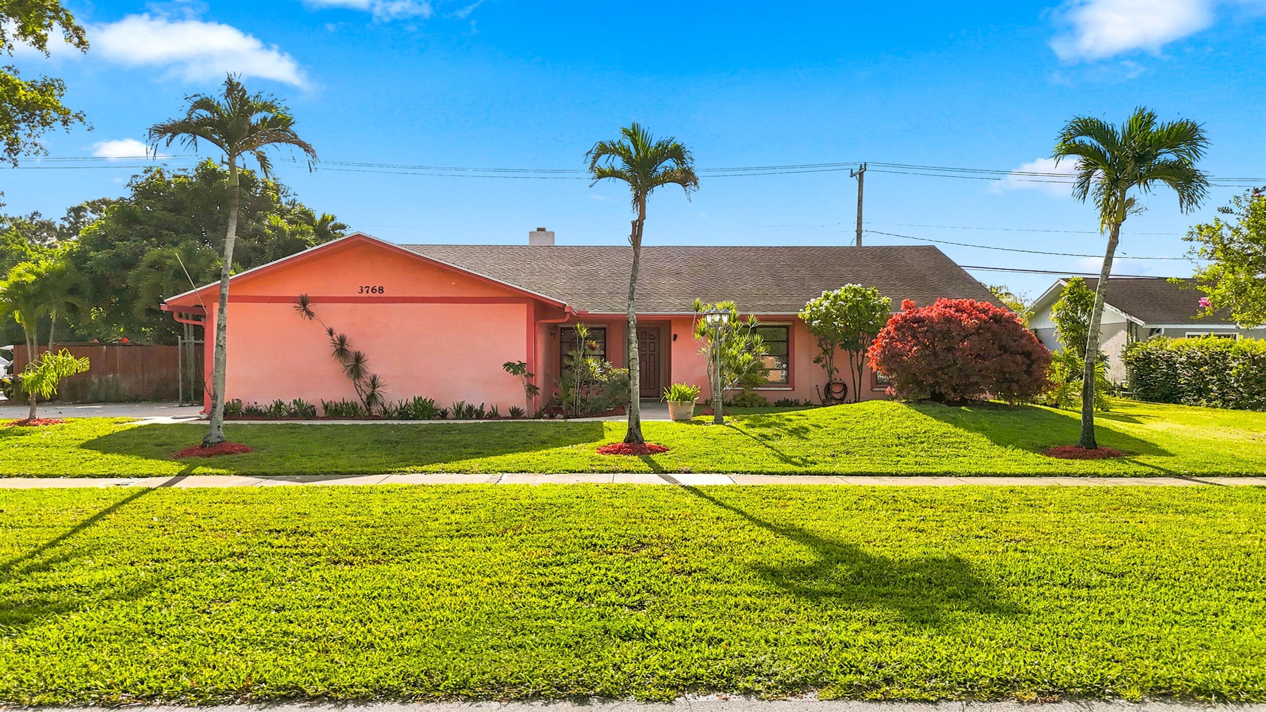 Spacious 4-bedroom, 2-bathroom pool home offering incredible potential in one of Lake Worth's most desirable locations! Situated on a large fenced lot with beautiful golf course views and NO HOA, this property combines privacy, space, and endless possibilities. Designed for comfortable living and entertaining, the home features a formal living room with a cozy fireplace, formal dining room, and a spacious Florida room complete with a wet bar, overlooking the screened-in pool and lush backyard. The tile flooring throughout provides easy maintenance, while the expansive covered patio creates the perfect space for outdoor gatherings. The oversized primary suite offers a peaceful retreat with a large walk-in closet, dual-sink vanity, soaking tub, and separate shower. Additional  highlights include a 2-car garage, newer roof, sprinkler system, and storm shutters for hurricane protection, providing added peace of mind. Step outside to your private backyard oasis featuring a screened-in pool, a large covered porch, mature tropical landscaping, fruit trees including mango and avocado, and a canal behind the property, all while enjoying serene golf course views. Conveniently located in the heart of Lake Worth, just minutes from the Florida Turnpike, I-95, shopping centers, restaurants, Wellington International (Equestrian Center), parks, and South Florida's beautiful beaches. Move-in ready with endless potential to update and make it your own. Don't miss this rare opportunity to own a pool home with golf course views, no HOA, and an unbeatable location. Schedule your private showing today!