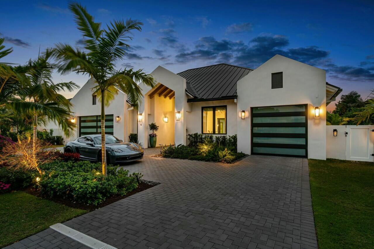 Embrace resort-style living in this bespoke coastal Zen-like retreat, meticulously designed as the personal sanctuary of a dedicated designer. This exquisite new residence in Delray Beach's desirable Lake Ida neighborhood, crafted by Bella Homes, is a masterful blend of luxury, modern technology, and sustainable craftsmanship, tailored for discerning homeowners seeking tranquility and elegance.

As you enter, expansive glass doors usher in natural light, seamlessly connecting the open great room and gourmet kitchen with the stunning outdoor space. The foyer, adorned with wide plank French white oak flooring, custom ceiling beams, and elegant Phillip Jeffries wallpaper, sets a sophisticated tone. The great room impresses with custom built-ins, a travertine accent wall, and a cozy fireplace.

The chef's kitchen is a culinary masterpiece, featuring custom millwork, floor-to-ceiling cabinetry, and a striking quartzite waterfall island. Outfitted with high-end Thermador appliances, including a 6-burner gas stove and Miele coffee machine, this space is perfect for both cooking and entertaining.

Adjacent to the kitchen, a unique custom bar and lounge offers an inviting atmosphere for gatherings. With a stunning 14' granite bar, a 250-bottle wine system, and top-tier appliances, this space is designed for effortless entertaining.

Escape to the ultimate retreat in this exquisitely designed primary suite, featuring floor-to-ceiling sliders leading to a private patio and spa. Enjoy the luxury of motorized sunshades and an exquisite ensuite bath with a soaking tub, rain shower, and custom double vanity. His and Hers walk-in closets add to the suite's allure.

Two generously sized en-suite guest rooms provide plush accommodations for family and friends, complete with custom closets and elegant bathrooms. A versatile office/guest bedroom features a Murphy bed, catering to both work and leisure.

Step outside to your private oasis, featuring a resort-style saltwater pool, oversized whirlpool spa, and fully equipped summer kitchen, perfect for alfresco entertaining. The landscaped grounds are enhanced by an Aqualink system for effortless pool management and a zoned sprinkler system.

This Lake Ida estate integrates cutting-edge technology with energy-efficient systems, including a Control4 smart home system, impact windows, and a whole-house generator. The exterior showcases a standing seam metal roof, circular driveway, and a spacious 2-car garage with a charging station and an additional golf cart garage, which is air conditioned.

Bella Homes, recognized for their commitment to luxury and sustainability, has created a residence that exemplifies coastal elegance and modern living. Experience the perfect harmony of style, comfort, and innovation at The Vineyard.

Enjoy your own private retreat & personal resort in the heart of Lake Ida, minutes from downtown Delray Beach and its exciting restaurants and shops, as well as less than 2 miles to the beaches. Experience bespoke luxury and ultimate Delray Beach lifestyle at 6 NW 17th Street. 

The information published and provided including but not limited to prices, measurements, square footage, lot sizes, features, finishes and calculations are subject to errors, omissions or changes without notice. All such information should be independently verified. All parties should perform their own due diligence to verify all information.