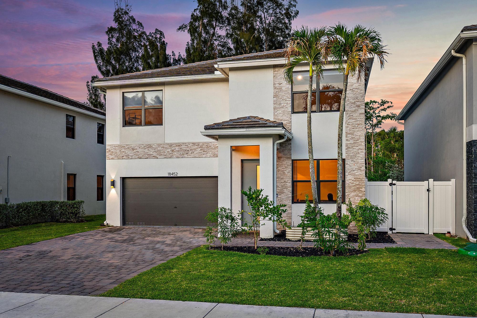 Welcome to the Reserve at Jupiter! This 2023 constructed CBS home offers 5 bedrooms, 3 full bathrooms, and the perfect blend of style, comfort, and location. Situated on a premium PRESERVE lot, this beautifully maintained home features a fully fenced backyard with a sparkling private HEATED pool, creating the ultimate South Florida retreat with added privacy and tranquil views. Inside this PARKER model with complete IMPACT windows throughout, you'll find spacious OPEN-concept living areas, modern finishes, abundant natural light, and a thoughtfully designed floor plan ideal for both entertaining and everyday living.  Upon entering you are greeted by a front room that can accommodate an office space, play area or formal sitting room perfect for relaxing. The kitchen, dining and living room is SPACIOUSLY appointed to bring people together with easy access to the beautiful backyard. One full bath and bedroom round out the bottom floor as well as a spacious two car garage equipped with a TESLA Charger. Upstairs you will find FOUR additional spacious bedrooms  including the private PRIMARY bedroom with ensuite bathroom, and a LOFT space with endless possibilities.  Step into your own private backyard OASIS designed for luxury outdoor living and effortless entertaining. This stunning outdoor space features elegant sandblasted MARBLE decking surrounding a sparkling SALT WATER POOL, creating the perfect setting to relax and enjoy the South Florida lifestyle year-round. Lush TURF landscaping offers both beauty and low-maintenance convenience, while the fully fenced backyard provides privacy and plenty of room for all. Overlooking a SERENE preserve, this exceptional setting delivers peaceful natural views with no rear neighbors, making it the ultimate retreat for quiet mornings and relaxing evenings.  This D.R. Horton home is just minutes from A-rated Jupiter schools, pristine beaches, world-class golf courses, fine dining, shopping, and easy access to I-95 and the Florida Turnpike for convenient commuting. Enjoy the best of the Jupiter lifestyle in this exceptional move-in ready pool home surrounded by natural beauty and close to everything South Florida has to offer.
