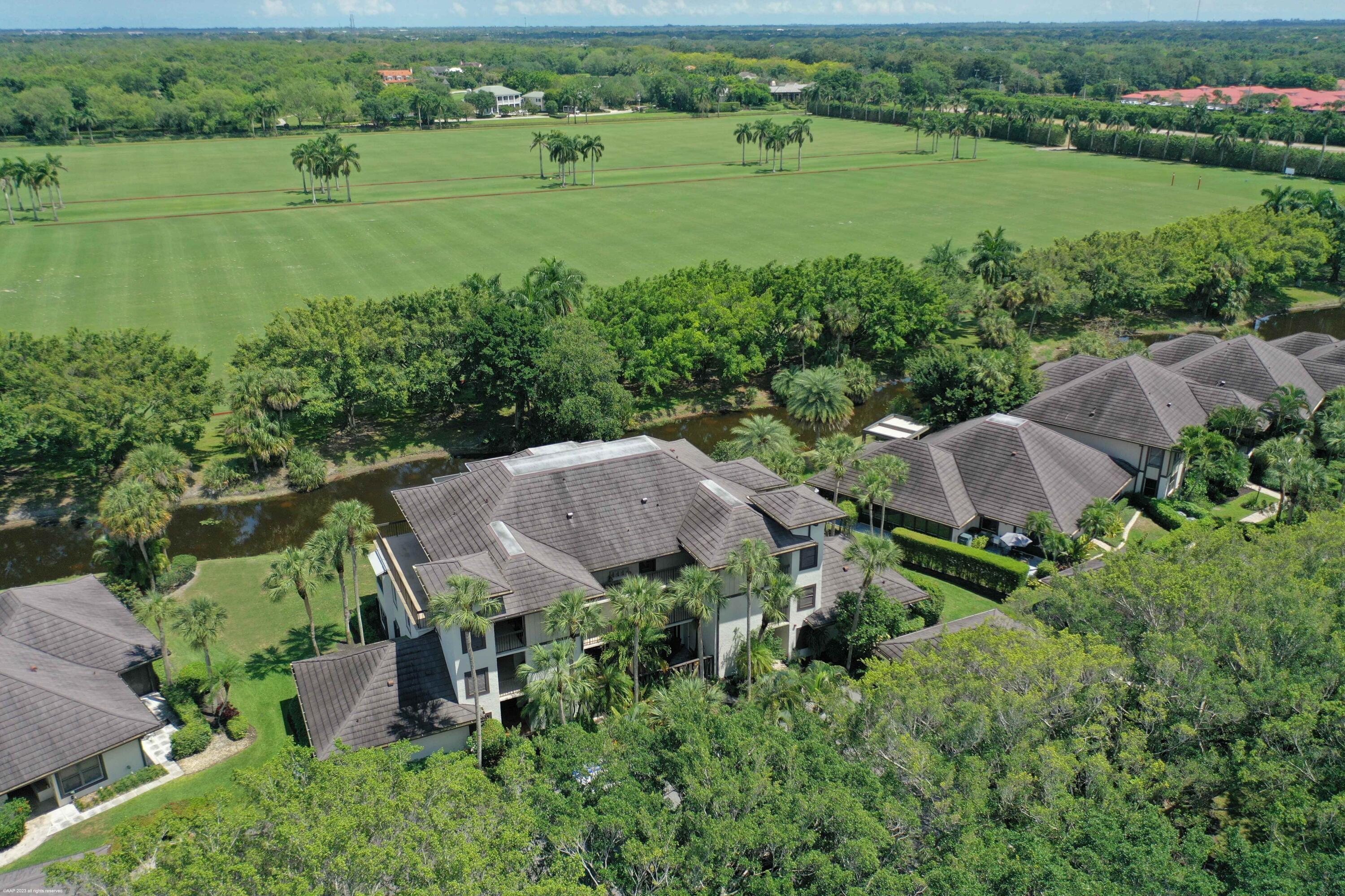 Spend the season in this beautiful penthouse on Polo Island in Palm Beach Polo & Country Club. Easy access with the elevator to this condo that covers the entire third (top) floor of the building with private balconies off each one of the four bedrooms. Each bedroom comes with an updated ensuite bathroom and the bedrooms are located on each corner of the unit, providing privacy for everyone. Completely updated throughout with impact glass windows and sliders. Relax and enjoy the peaceful water views and gorgeous mature trees. Private laundry and two covered parking spaces. Polo Island condos also have their own community pool. DISCLAIMER: All information provided to you regarding this Property by realtor and her associates has been obtained from third parties such as the  Multiple Listing Service public records and other sources. All Tenants should independently verify all information provided regarding this Property. The Landlord, realtor and broker make no representation as to the accuracy of this information. All Tenants should perform their own independent due diligence regarding this Property before executing a Lease for the Property.
