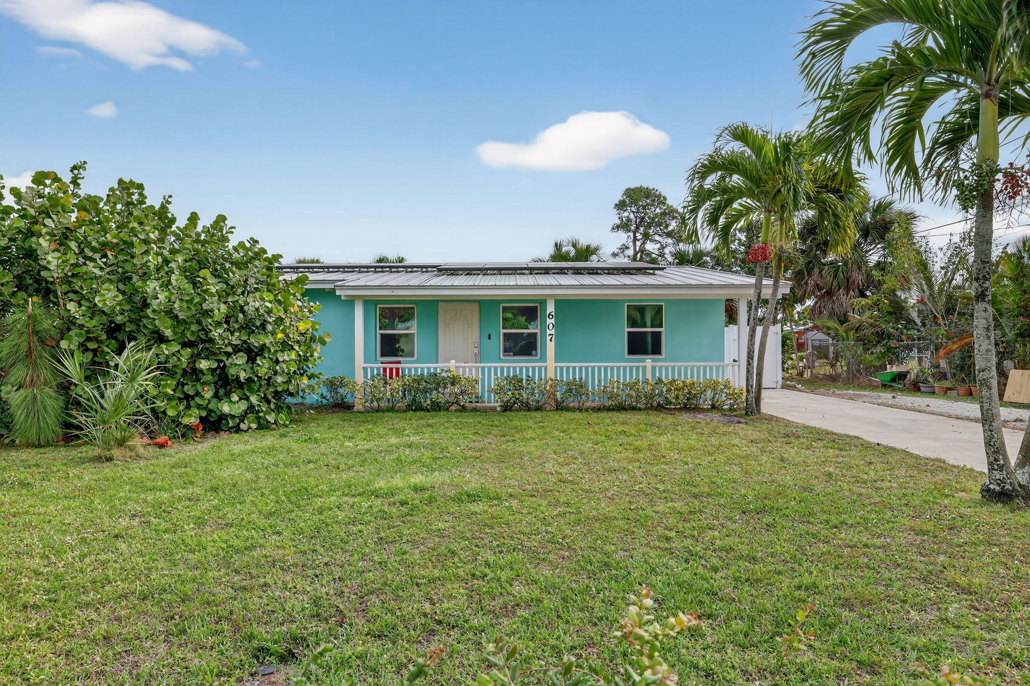 This home delivers efficiency, longevity, and peace of mind with: impact windows and doors (2021), standing seam metal roof (2022), newer HVAC (2022), and a fully paid solar array installed in 2023- average bill is $45/mo. The fresh interior/exterior paint (2025), waterproof, wood-look plank flooring (2025), stainless steel appliances, smart home features controlling both the AC and irrigation along with 8 cameras will enhance your everyday living. Outdoor highlights include a fully screened patio, PVC privacy fence (2021), irrigation well, and two sheds—one insulated with A/C and electric. This home is a rare find for buyers who value efficiency, durability, and true move-in readiness.