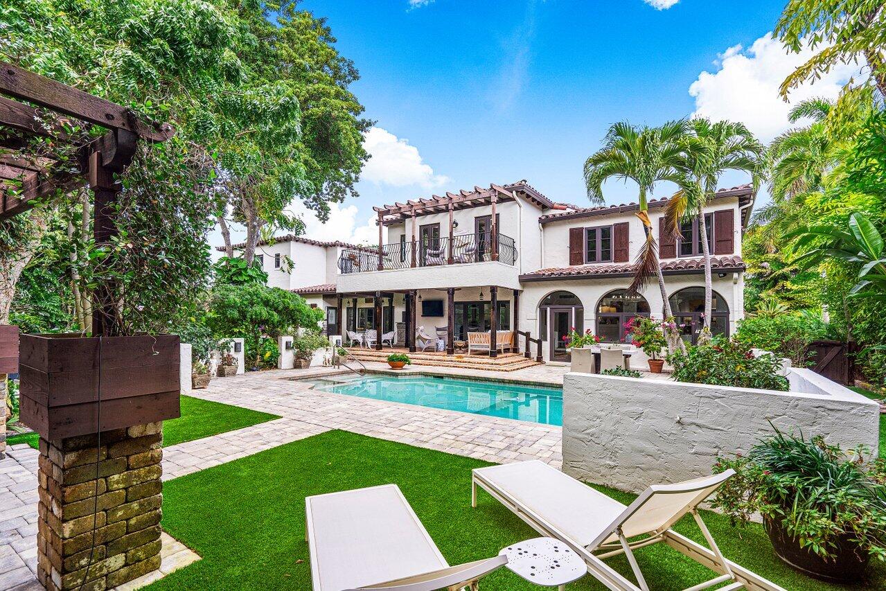 Rare Gem!  Privacy, charm and distinction blend seamlessly in this Historic estate built by Addison Mizner in desirable Old Floresta. Sited on a half-acre corner lot, this 6-bedroom 4,500 sq ft home has been completely renovated, preserving the historic features and character of the original design. Pecky cypress ceilings, Chicago brick walkways, wood burning fireplace, hardwood floors, and arched windows are a few of the characteristics that make this home special. The entire home has impact resistant glass windows and newly renovated bathrooms. 
The chef's kitchen has been modified and remodeled with custom cabinetry, Wolf and Sub-Zero appliances, and an oversized island with seating for six. This magnificent tropical oasis, beautifully landscaped with flowers, tropical plants, and a loggia with spacious backyard and resort-inspired pool.