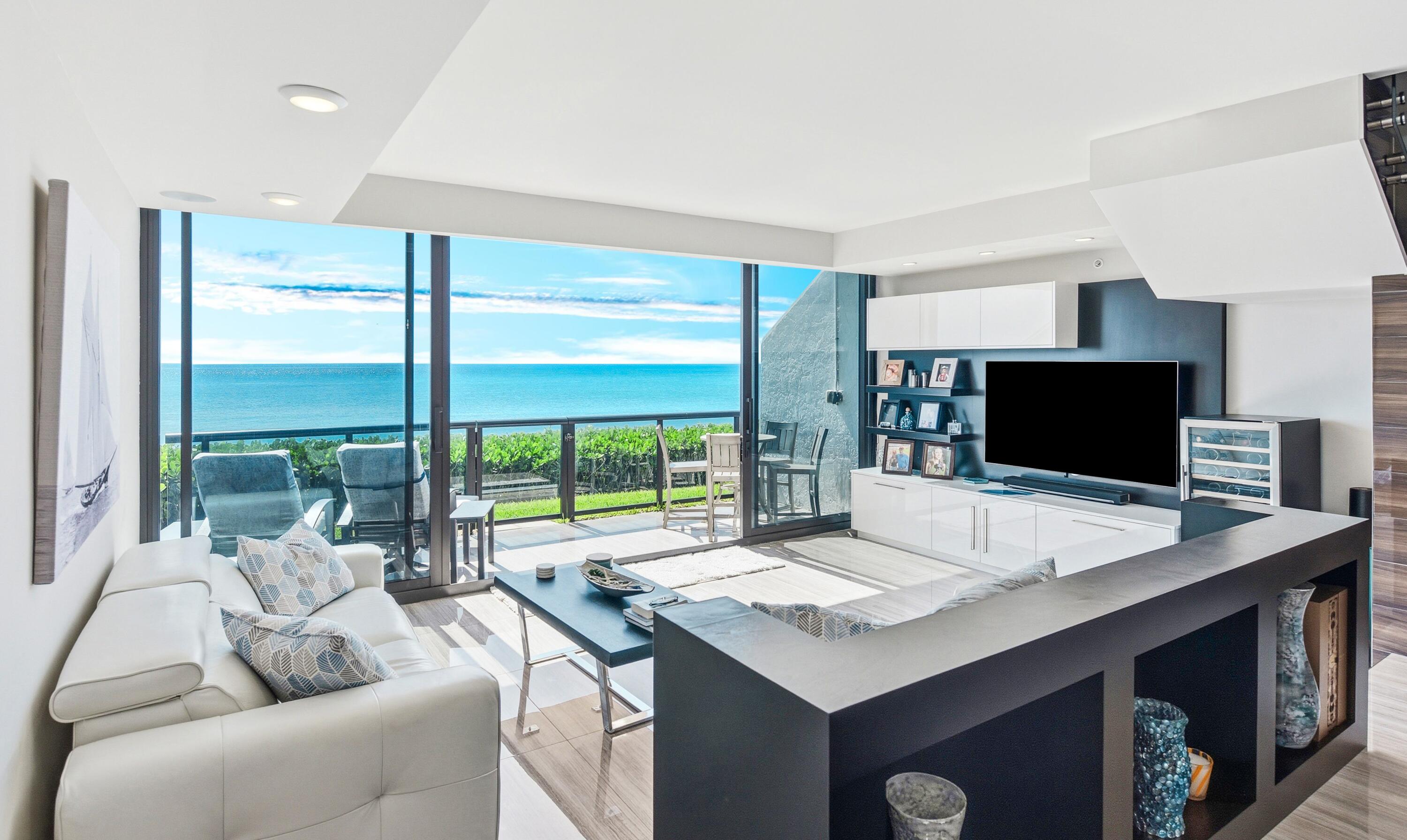 Recently renovated, fully furnished and turnkey 3 bedroom, 2 1/2 bath townhome with unrivaled direct walk out to the beach and breathtaking panoramic vistas of the Atlantic Ocean. This townhome is a masterpiece of design, having undergone a complete transformation with top-of-the-line finishes and surround sound throughout. The kitchen, a culinary dream, seamlessly connects to both the dining room and the family room, granting you unobstructed ocean views. The primary suite offers direct ocean views and opens to a balcony overlooking the sparkling blue water, a perfect retreat for your morning coffee. The bathrooms have been meticulously remodeled offering a spa like experience and features a luxurious steam shower with a convenient bench completing a Zen like experience on the shores of the Atlantic. Beyond the townhome's remarkable features, the building itself has recently undergone comprehensive concrete restoration and updates, including a beautifully refreshed pool area and a state-of-the-art gym facility. Pet friendly. Two garage spaces.