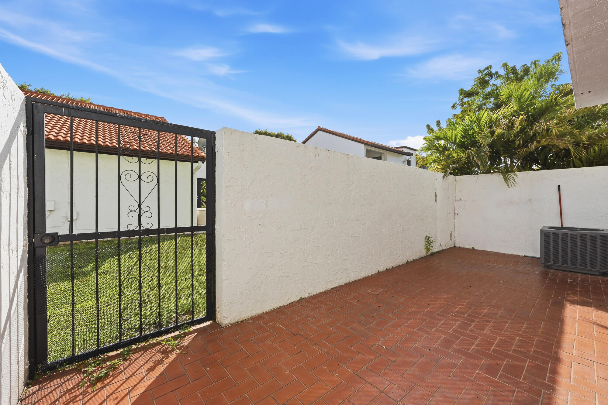 Investor Opportunity with Immediate Cash Flow!  Welcome to 1461 SW 124th Ct #C-13, Miami, FL 33184—a beautifully renovated townhome offering immediate income potential with a tenant already in place for the next 15 months, making this an ideal turnkey investment opportunity. This spacious 2-bedroom, 2.5-bath residence features approximately 1,640 square feet of well-designed living space, with the flexibility to potentially convert to a 3-bedroom layout for added value and future versatility. Recent renovations provide a modern, move-in-ready feel, including tile flooring throughout the first floor, warm wood flooring upstairs, updated appliances, and tastefully refreshed finishes throughout. The bright and open floor plan is enhanced by soaring ceilings and abundant natural light, creating an inviting atmosphere for tenants and future homeowners alike. The kitchen seamlessly connects to the living and dining areas, offering functional everyday living and entertaining space. A convenient half bath is located on the main level, while upstairs, both generously sized bedrooms feature private en-suite bathrooms for maximum comfort and privacy. Outdoor living is equally appealing, with both front and rear patio areas providing additional space to relax and enjoy South Florida's year-round sunshine. What truly sets this property apart is its exceptional location. Situated in the highly desirable Tamiami area, residents enjoy being just minutes from Dolphin Mall, Florida International University, Tamiami Park, major supermarkets, shopping centers, dining, and entertainment. Quick access to the Florida's Turnpike and other major roadways provides convenient connectivity throughout Miami-Dade County while maintaining the peaceful residential character of the community. Whether you're looking to expand your investment portfolio with an income-producing asset or secure a property in one of Miami's most sought-after rental markets, this renovated townhome presents an outstanding opportunity with built-in cash flow from day one.