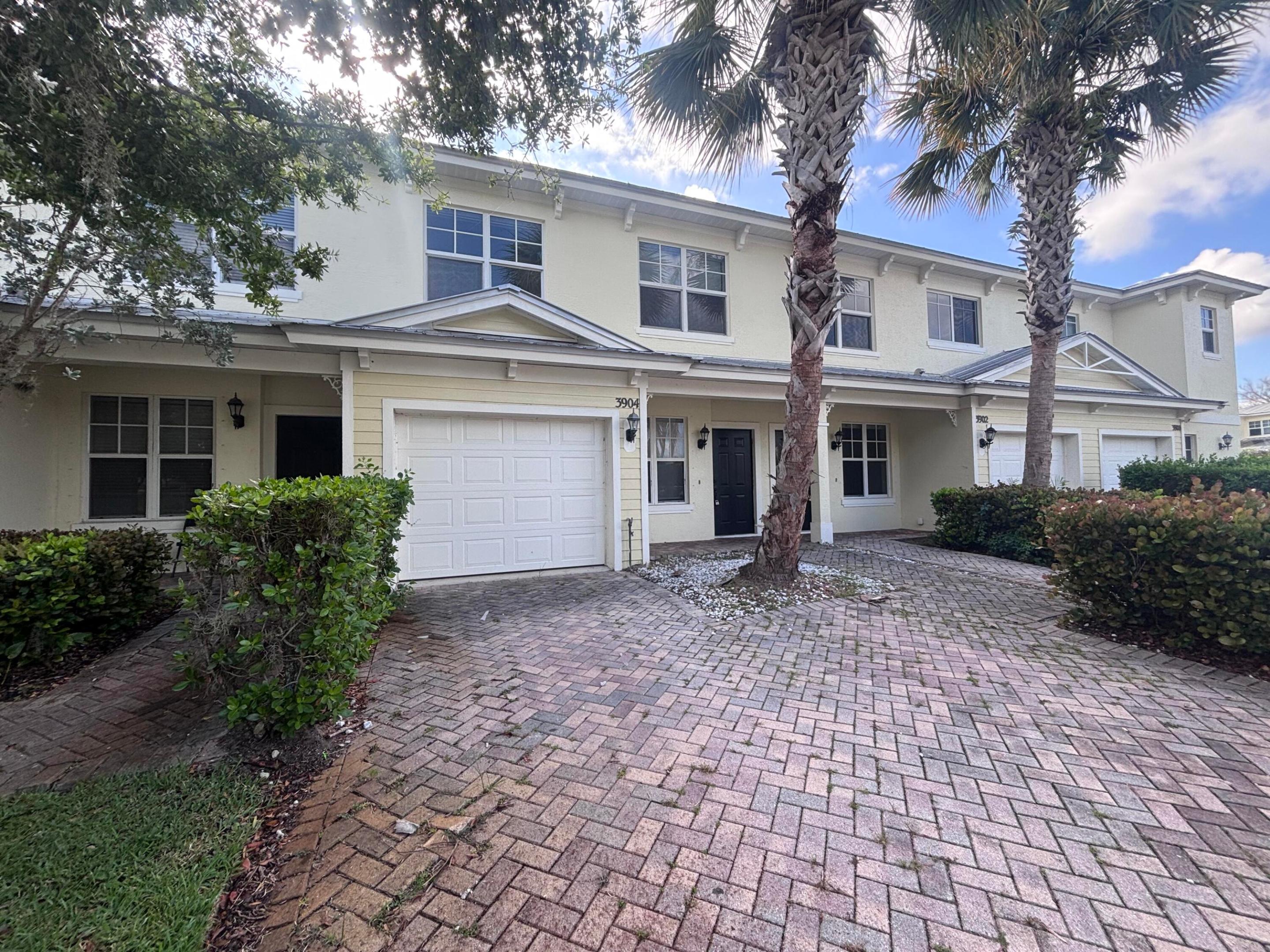 Available for immediate occupancy, this move-in ready 4-bedroom, 2.5-bathroom townhouse is located in the desirable River Oaks neighborhood and features a budget-friendly move-in requirement of only the first month's rent and a one-month security deposit. The home offers a clean, modern layout with vinyl plank flooring throughout and a spacious kitchen equipped with nice quartz countertops. The main bedroom suite provides a comfortable private space, complete with a large walk-in closet, a double sink vanity, a soaking tub, and a separate shower. The property is perfectly situated within the community, featuring a private balcony with a peaceful view of the neighborhood nature preserve, and it sits directly across the street from the community pool.  It is also ideally located for an easy commute, sitting just minutes from US-1, downtown Fort Pierce, local schools, and plenty of shopping. Immediate occupancy is available pending community approval, and all applicants must meet the minimum credit score requirement and pass standard income, background, and reference verifications.