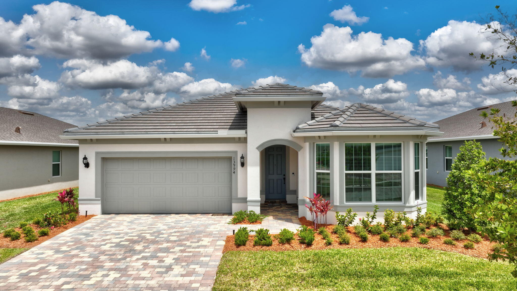 Welcome to exceptional waterfront living in the highly sought-after Del Webb community of Port Saint Lucie. Perfectly positioned on a premium water lot, this beautifully brand new upgraded 2-bedroom plus den, 2 ½ bath residence offers the ideal blend of luxury, comfort, and effortless Florida living.   This Stunning home is furnished with new furniture and has never been lived in!!!   Designed with both style and functionality in mind, the home features a bright, open-concept layout that seamlessly connects the main living spaces.  The upgraded kitchen is a true standout, showcasing enhanced finishes and many upgrades, high end cabinetry, and a layout perfect for entertaining new friends and everyday lifestyle.  The spacious primary suite serves as a private retreat, complete with an upgraded spa-like bath designed for relaxation and comfort. A versatile den provides the perfect space for a home office, guest room, or hobby area...Step outside to your extended screened-in lanai and take in serene water views—an ideal setting for morning coffee or evening gatherings. This premium lot offers both privacy and a tranquil backdrop that's hard to find. Additional highlights include gas service—a sought-after feature in the community—and the convenience of a fully furnished home, allowing for a truly move-in-ready experience.  Fabulous upgrades include: tile roof, extended large screened-in lanai, 8-foot doors with black hardware throughout, crown molding, wide trim and baseboards, upgraded gourmet kitchen with gas range and wood-clad hood, KitchenAid appliances including large french door refrigerator, dishwasher, built in microwave and wall oven, under cabinet lighting, pullout cabinet drawers, large pantry, pendant lights, oversized island with large single sink and industrial black faucet.  Master bedroom suite: tray ceiling, ceiling light/fan, 2 large walk-in closets, and window treatments include electric banded shade.  Spa-like master bath includes custom mosaic floor tile, large open shower with floor to ceiling tiles, listello, niche, black fixtures and hardware, plus linen closet.  The 2nd bedroom boasts a large bay window, fan/light, on-suite bath with frameless shower door, black fixtures and hardware, listello, shelving, floor to ceiling tile, linen closet, and large walk-in closet.  Office/3rd bedroom: glass french doors, tray ceiling, additional overhead dimmable lighting, fan/light, closet, and double window with banded shade.  This home also includes a centrally located half bath and additional large storage closet just off the entry hallway.  Entry from the 2 car garage includes a spacious drop zone.  Laundry room has been upgraded to include: sink, cabinetry, and front load whirlpool washer and gas dryer.  Rinnai instant gas hot water heater ensures ample hot water at a cost savings. Living room has dimmable overhead lighting with a large 72-inch fan/light.  Both the dining  and living room have large sliders with electric banded shades to easily adjust lighting or privacy leading to paved extended screened-in lanai with privacy shade.    Located within Del Webb, residents enjoy access to resort-style amenities including a clubhouse, fitness center, pool, tennis and pickleball courts, and a vibrant calendar of social activities. This is more than a home—it's a lifestyle. Don't miss the opportunity to own one of the community's most desirable homes!!  Call for a showing today of home and club house...