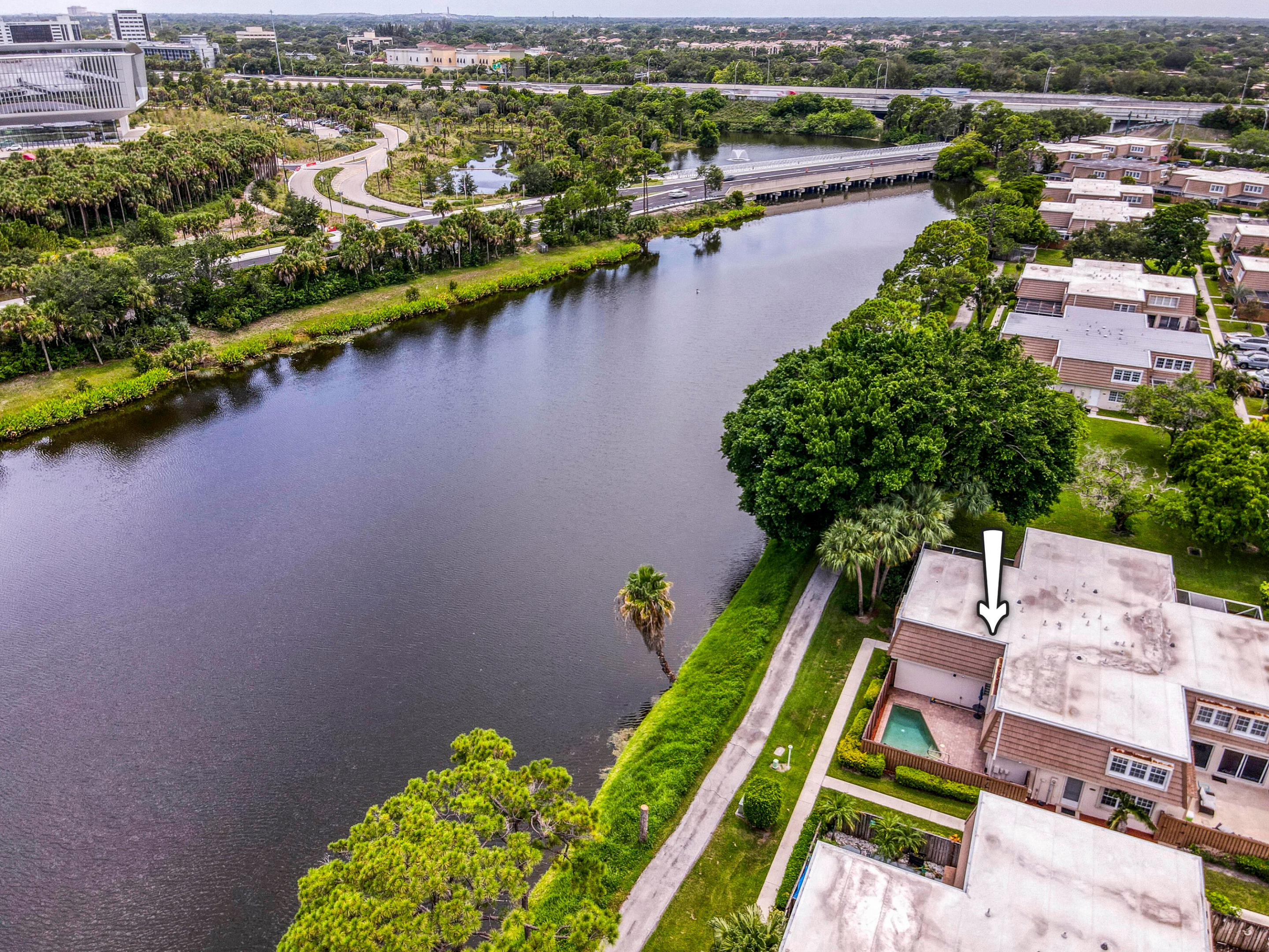 Stunning waterfront two story townhouse in Palm Beach Gardens with a pool! Impeccably maintained, move in ready 3 Bedroom 2.5 bath home. Updated throughout, new windows, cabinets, floors, crown molding, pavers, granite countertops. newer AC, plantation shutters, California closets, travertine/marble bathrooms, granite/quartz countertops, accordion shutters, frameless shower. This home has it all & it's been Meticulously Maintained, not to mention an ideal location in the heart of Palm Beach Gardens w/easy access to I-95 the Turnpike, great restaurants.  Pool and lake view, brand new interior paint, newer appliances new pool equipment.
