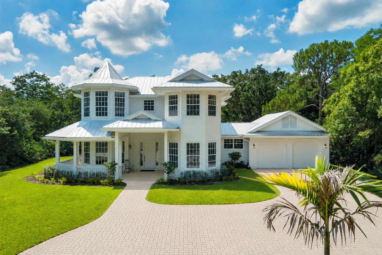 Where do you find a residential property with land in South Florida? 1001 SE Rand Road located in Ranch Colony's exclusive Ranch Estates, the private guard-gated community in Jupiter. The only gated community with 36 residences homesites with 20 to 50 acres. The beautiful winding drive leads you up to his 4-bedroom, 4 bath Victorian home which has a wrap-round porch, fireplace, an office, attached 2-car garage and a separate large, detached 2-car garage. The 2,800 SF house sits on 20 acres, including wetlands and extensive landscaping offering ultimate privacy for the discerning buyer. The Estates also has pastures, barns and Kennels available for residents. 1001 SE Ranch Road is a great opportunity to move right in or built your own ultimate private retreat.
