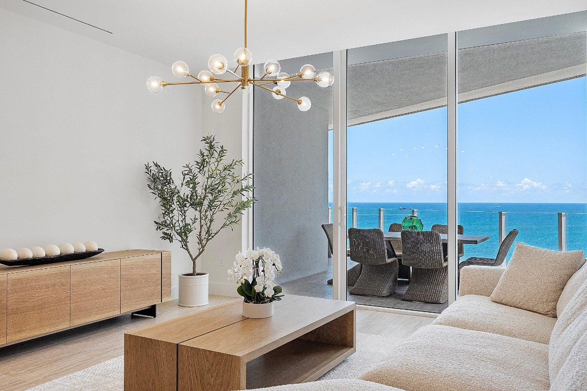 Experience elevated beachfront living at the Four Seasons Fort Lauderdale Private Residence 1801. Perched on a premier floor with coveted southeast exposure, this impeccably furnished home captures sweeping ocean and Intracoastal views from every room. A full-length terrace invites seamless indoor-outdoor living, framing sunrise-to-sunset vistas. Interiors exude sophistication with marble baths, Waterworks and Dornbracht fittings, and a gourmet kitchen with Miele, Wolf, and Sub-Zero appliances encased in Italcraft cabinetry. Furnishings by Arhaus. Offering three bedrooms plus a den, bonus storage, valet, two self-parking spaces with dedicated electric for EV charging, and the unparalleled service of Four Seasons—concierge, Michelin-inspired dining, spa, pools, and beach service.