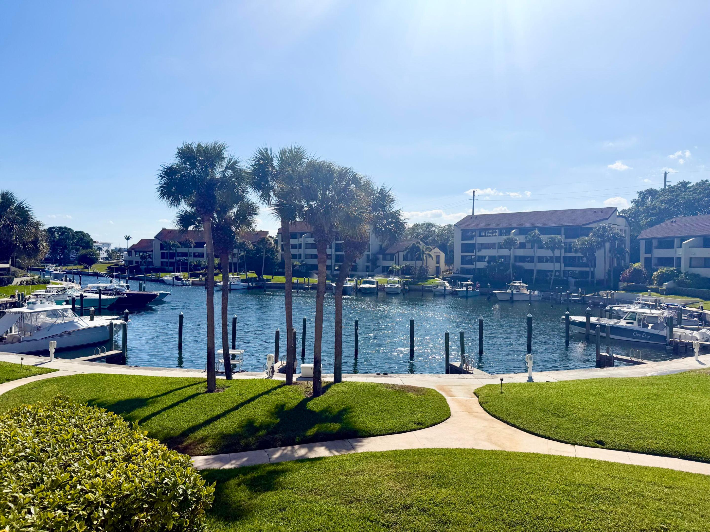 Rare opportunity to own a 180 degree spacious harbor waterfront 3BD/3BA retreat with WALLS of GLASS! Stunning Vistas! Gated boutique /enclave of Harbor Village. Boating Community with resort style pool/spa, 2 mile harbor walking path, on site restaurant and private marina. Minutes to North Palm Country Club w/Nicklaus golf course, tennis ctr, restaurant and Olympic pool. Open chefs kitchen w/wood/glass custom cabinetry/granite countertops/Stainless steel appliances.Breakfast bar. Three wraparound terraces invite natural light. Primary suite w/3 walk in closets. Luxurious bath w/spa tub, separate shower, dual sinks. Custom wet bar. Genuine hardwood floors throughout. Laundry room w/loads of storage. Split floor plan. No special assessments. Recently completed concrete restoration. Low HOA.