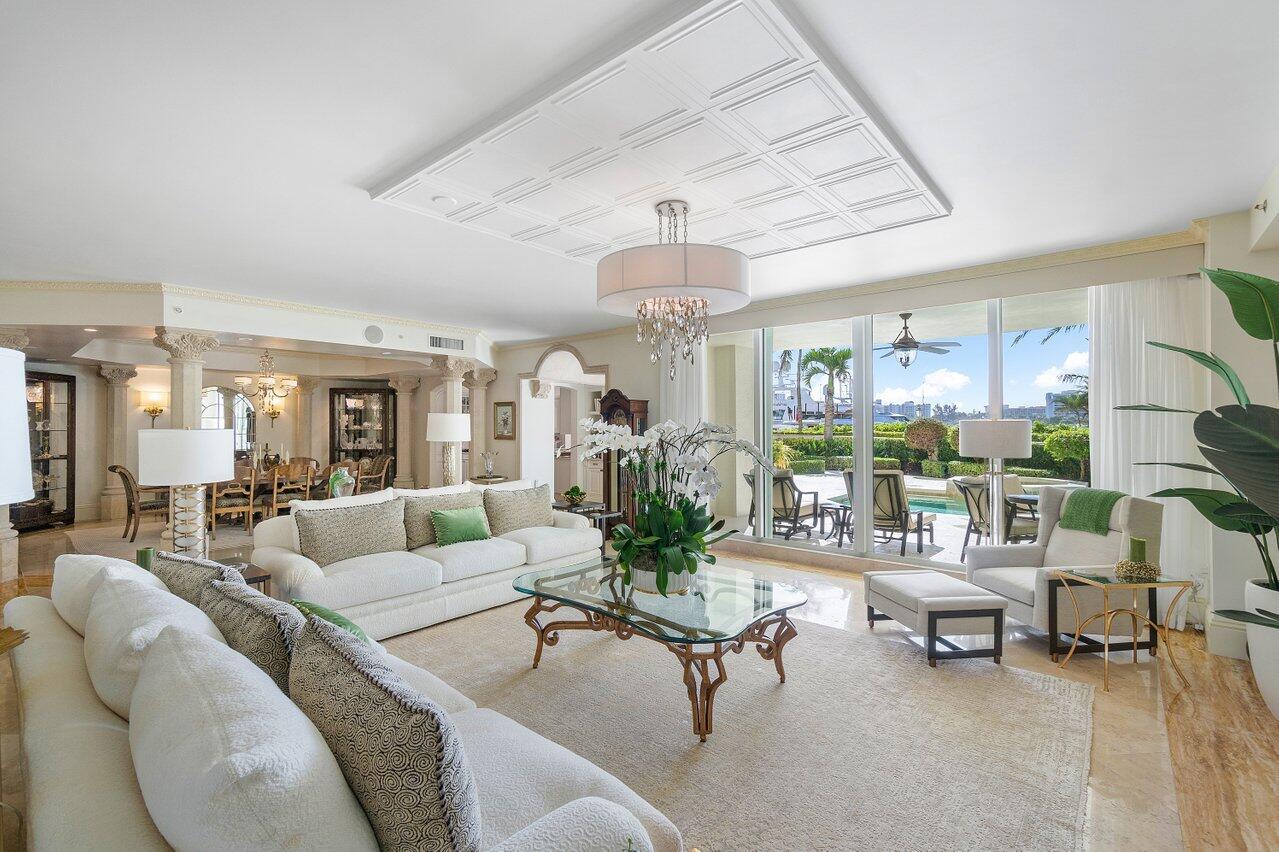 This exceptional residence in Mizner Grand embodies the essence of luxurious living, offering the privacy and elegance reminiscent of a grand estate. Step outside to your own secluded oasis, complete with a private pool and spa overlooking the serene Lake Boca. Spanning an impressive 5200 square feet, this home is a masterpiece of classic design with transitional elements, meticulously curated for discerning tastes.
The spacious master suite boasts breathtaking views of the Intracoastal, accompanied by a lavish Roman bath featuring a sitting area, separate his and her bathrooms, expansive walk-in closets, and a dressing area. The gourmet kitchen is a culinary haven, outfitted with top-of-the-line appliances and a charming eat-in area overlooking Lake Boca. Luxury amenities abound, including two designated garage parking spots, private elevator entry, soaring 10-foot ceilings, and opulent marble and parquet flooring. Automated window treatments, adjustable dimmer lights, and integrated stereo systems enhance the ambiance throughout the residence.
Adjacent to the elegant club room, complete with a bar and Sub Zero wine cellar, lies a sophisticated theater room equipped with state-of-the-art Bose sound systems and soundproof walls, providing the perfect venue for entertainment and relaxation. Additionally, a second expansive terrace adorned with a tranquil fountain and meticulously manicured landscaping adds to the allure of this stunning property.