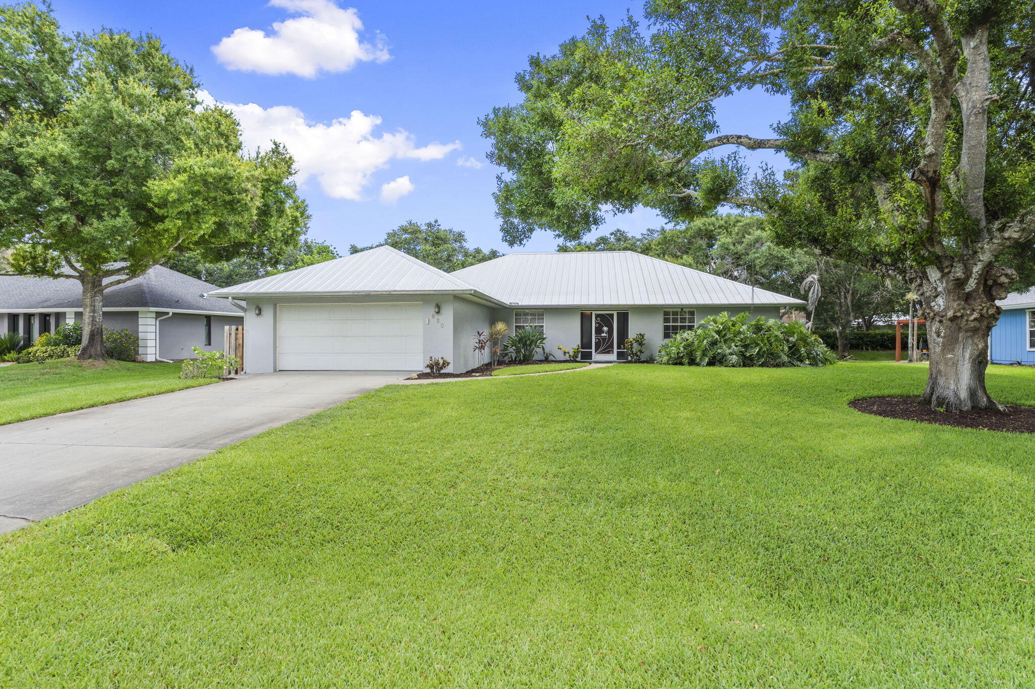 Nestled on a spacious 1/3-acre lot at the end of a quiet dead-end street, this beautifully maintained 4-bedroom, 2-bath CBS home offers the perfect blend of privacy, comfort, and Florida living. Surrounded by mature trees and lush landscaping, the private backyard creates a peaceful setting for relaxation and outdoor enjoyment. Designed with a desirable split floor plan, with vaulted ceilings, the home provides both functionality and privacy for family and guests. The spacious living areas flow seamlessly to the covered lanai and pool area, where you'll find a convenient cabana bath for easy access from the backyard—perfect for entertaining and enjoying sunny Florida days. Additional highlights include a durable metal roof installed in 2021, low HOA fee of just $300 per year, and plenty... of outdoor space to enjoy on the oversized lot. Whether you're hosting poolside gatherings or simply enjoying the tranquility of the neighborhood, this property offers an exceptional opportunity to own a wonderful home in a peaceful setting. Don't miss your chance to make it yours!