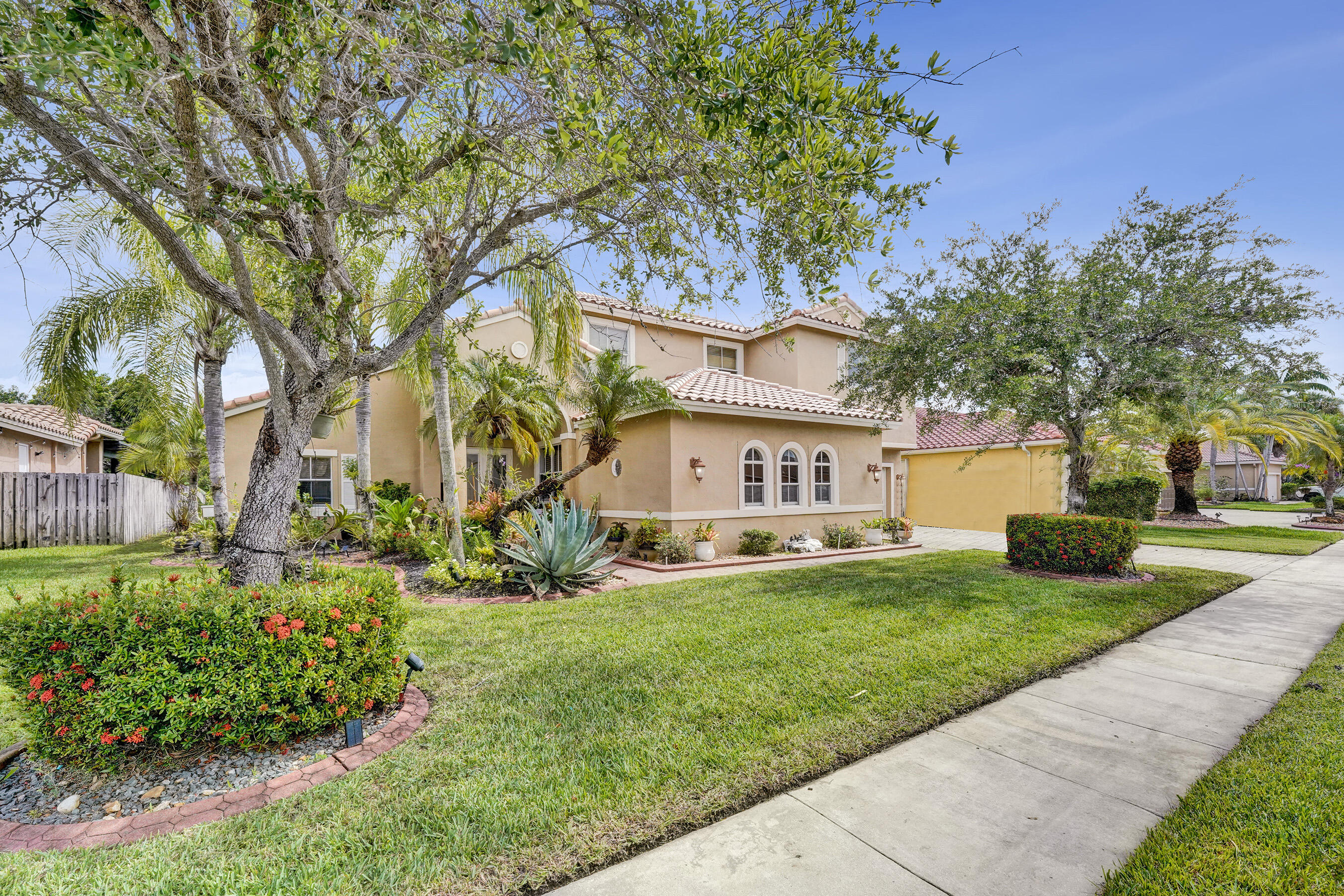 Perfectly situated on 10,000SF of privately fenced lot is this beautiful 5 bedrm 3-1/2 bath home in the desirable gated community of Encantada. It offers over 3600SF of beautifully reimagined living space designed for comfort & functionality. Step inside to this light filled 2 story, which features soaring 14 ft ceilings & abundant light to discover a huge kitchen with a spacious center island that seamlessly connects to the huge family rm. This layout offers multiple living & entertaining  areas downstairs, including a large fam room, living rm and separate dining rm. Also located on the 1st floor is a spacious bedrm or office with a full bath which adds flexibility for guests, in-laws or "work from home needs". Upstairs boasts an expansive primary suite + 3 bedrooms, 2bath.  The primary suite has generous walk-in closets and a spa like bathroom with a soaking tub and separate stand up shower. Step outside to your private backyard paradise with ample room for a pool. Encantada offers resort style amenities including clubhouse, pool, fitness center, tennis $ pickleball courts  + 24/7 security patrol. Conveniently located near shops, dining & major highways including I-75 and the turnpike. SELLERS MOTIVATED...SUBMIT OFFERS!!