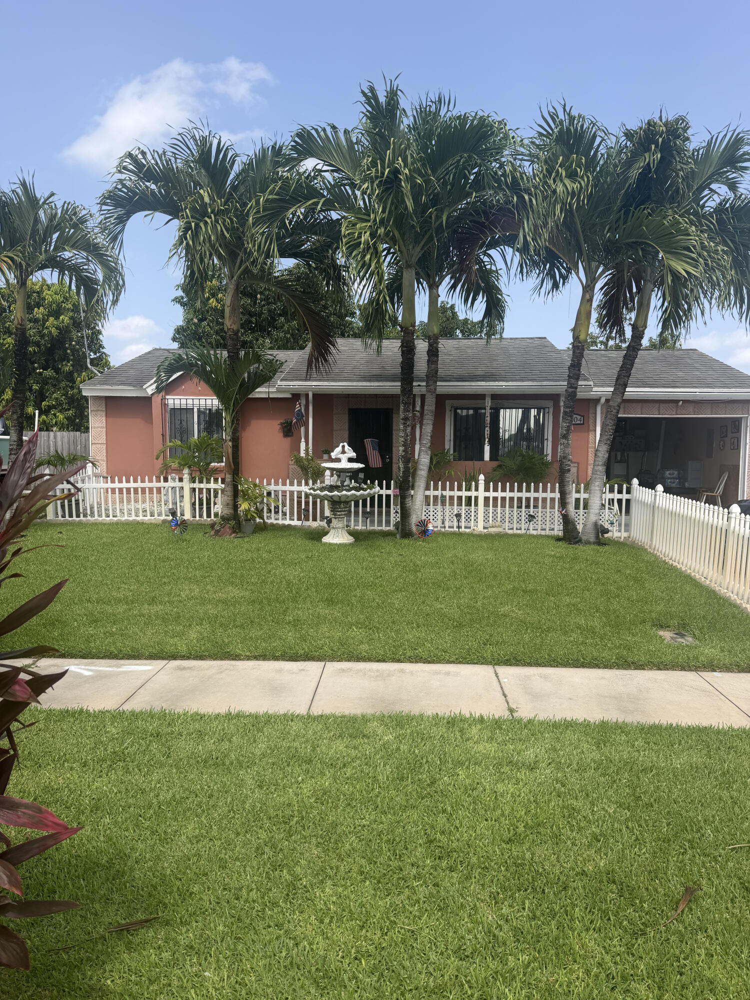 Welcome to this beautifully maintained home in the desirable Madison Green community of Royal Palm Beach. This spacious residence features an open and functional floor plan with abundant natural light, generous living areas, and a well-appointed kitchen perfect for everyday living and entertaining. The primary suite offers a private retreat with a walk-in closet and en-suite bathroom. Enjoy peace of mind with a brand-new A/C system installed in 2025. Step outside to enjoy a covered patio and a private backyard, ideal for relaxing or hosting friends. Conveniently located near top-rated schools, shopping, dining, parks, golf courses, and major highways. Enjoy the perfect combination of comfort, convenience, and Florida living in this move-in-ready home.