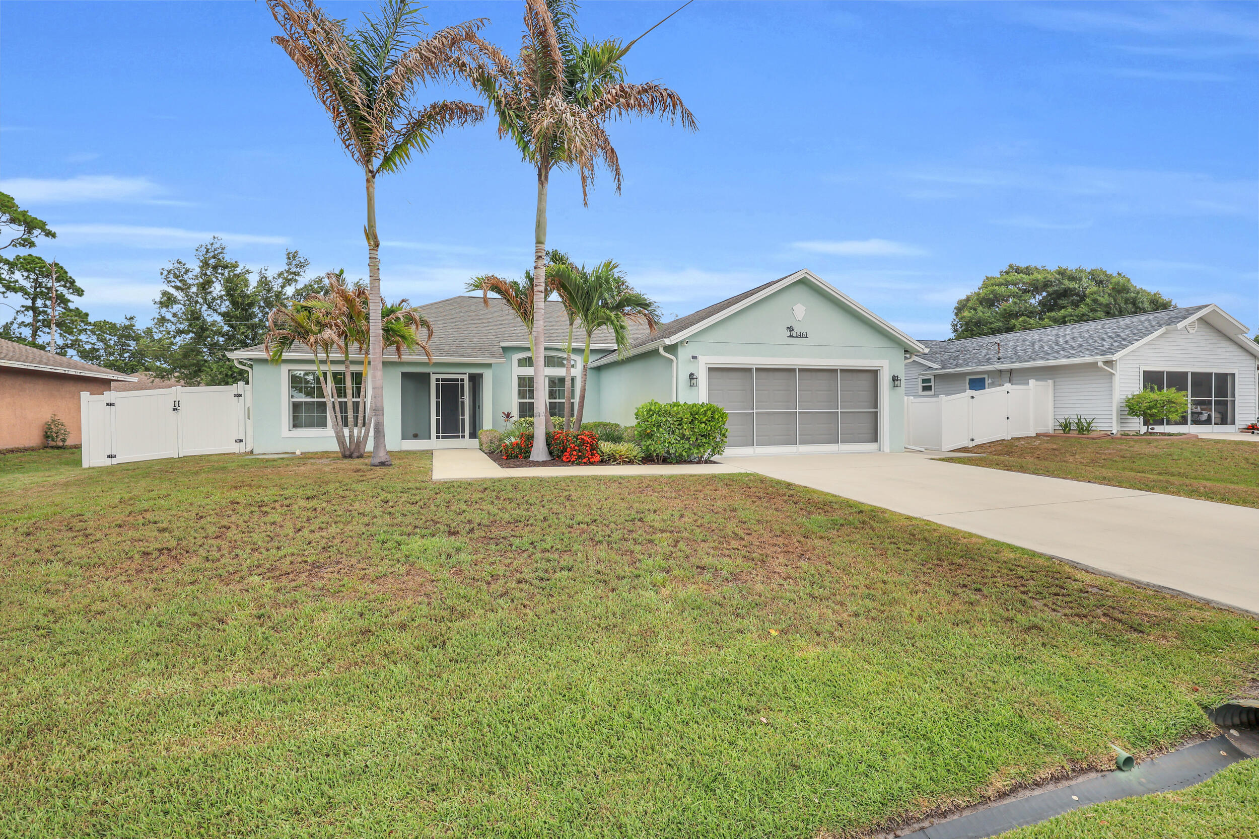 Welcome home to this beautifully maintained 3-bedroom, 2-bathroom CBS (concrete block) home built in 2017 and located in one of Port St. Lucie's most desirable non-HOA neighborhoods. Offering the perfect combination of quality construction, modern upgrades, and outdoor space, this move-in-ready home is ideal for anyone seeking comfort, convenience, and freedom from HOA restrictions. Pride of ownership shines throughout this one-owner home. The spacious split-bedroom floor plan features a beautifully updated primary suite with wood-look tile flooring, new baseboards, and a custom closet system. Bedrooms two and three have been upgraded with luxury vinyl plank flooring, providing both style and durability. The kitchen is equipped with a newer dishwasher, while the home's HVAC system has  been professionally serviced every six months since construction, offering peace of mind for the next owner. Impact windows and doors provide year-round storm protection, while accordion shutters on the rear French doors offer additional security. Exterior doors were freshly painted in 2026, adding to the home's curb appeal. Situated on an oversized quarter-acre lot, the backyard offers endless possibilities with plenty of room for a custom pool, outdoor entertaining area, garden, or space to store your boat, trailer, or recreational toys. Additional features include a two-car garage, garage screen door, gutters with underground drainage, and a thoughtfully designed outdoor space. Conveniently located near shopping, dining, schools, parks, golf courses, and major commuter routes, this Port St. Lucie home delivers the Florida lifestyle buyers are searching for. If you've been looking for a newer construction home with impact glass, no HOA, and a large backyard, this is one you won't want to miss.
