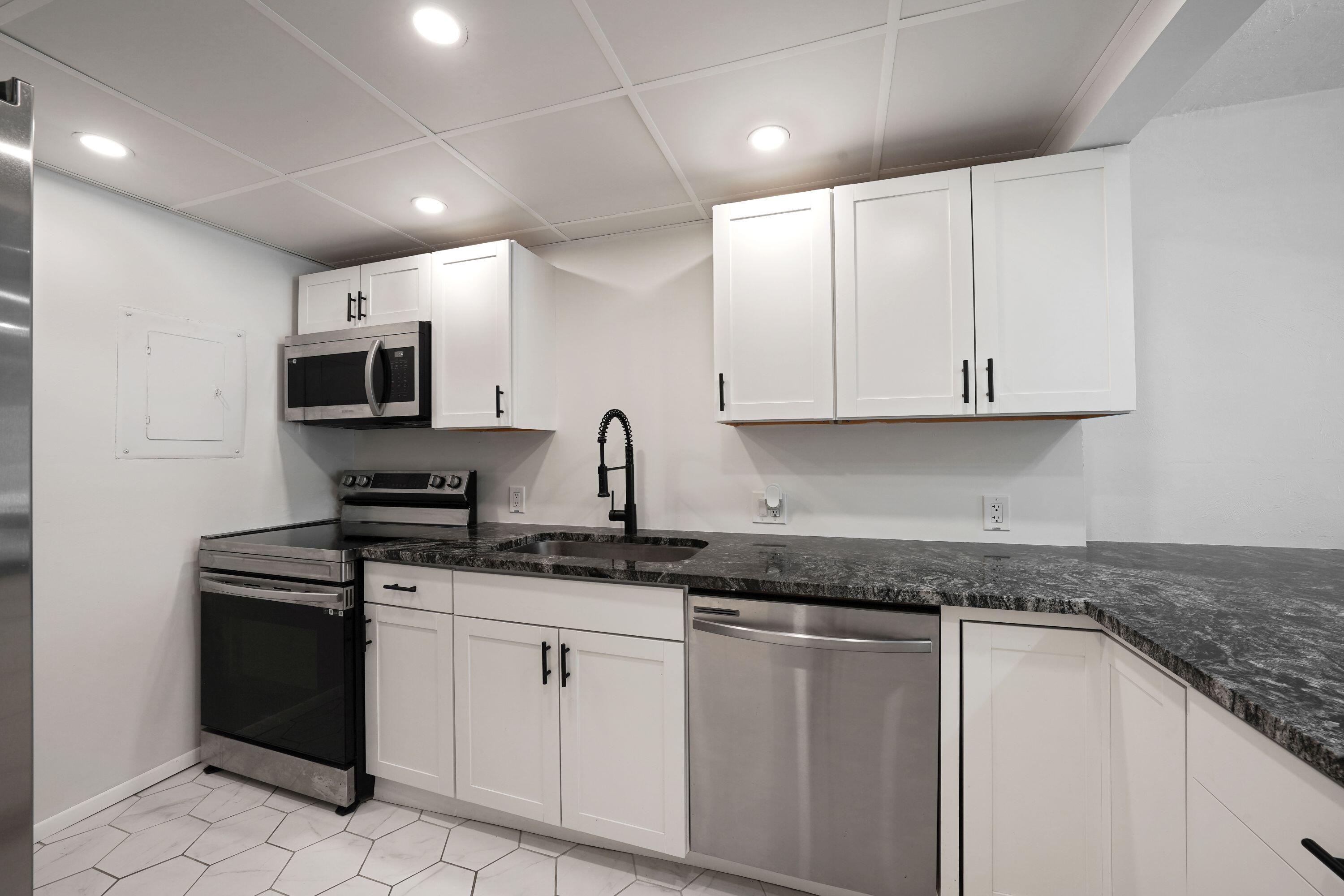 Welcome to this thoughtfully renovated, one-bedroom, one-and-a-half-bath condominium located in Omega Condo No 3 in Plantation, FL. This 960-square-foot residence offers efficient living space with practical floor planning across four stories.  New features include granite countertops, brand-new A/C, a spacious patio, stainless steel appliances, and much more! This unit also offers a half bath at the entryway for guests. Community features include a pool, gym, shuffleboard, and private inside access to the unit.   50-year building inspection completed and passed. Building has reserves.