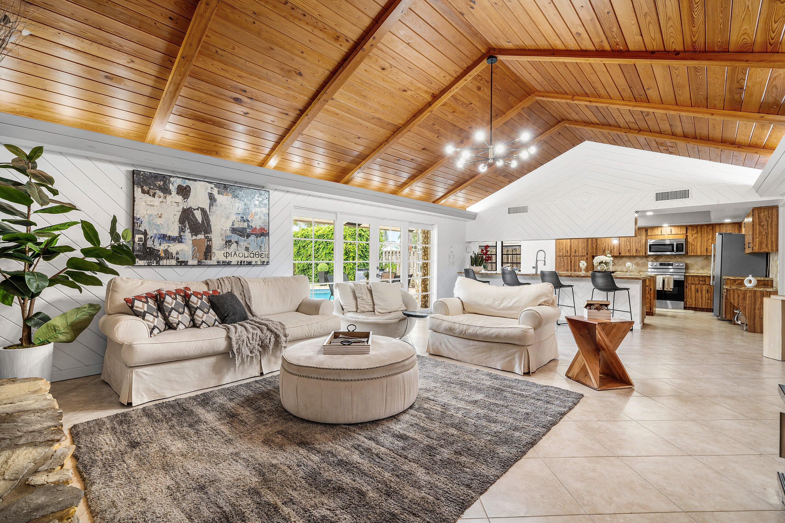One of the most unique homes in The Cove. This custom-built 5-bedroom, 3-bath open concept residence offers 2,700+/- square feet of living space on an oversized 13,124 sf lot in Deerfield Beach's most desirable neighborhoods.  A rare standout feature is the custom extended 4-5 car garage, offering endless possibilities for car enthusiasts, a workshop, home gym, additional storage, or recreational vehicles. The home features spacious living areas, abundant natural light, and a flexible floor plan designed for both everyday living and entertaining.  Enjoy peace of mind with a brand-new 2026 roof and an expansive backyard with plenty of room to relax and entertain. Ideally located just minutes from Deerfield Beach's award-winning beach, fishing pier, marinas, waterfront dining, shopping, and parks.  A truly rare opportunity to own a one-of-a-kind property with exceptional space, volume, functionality, and location.  The information published and provided including but not limited to prices, measurements, square footages, lot sizes, features, finishes, and calculations are subject to errors, omissions or changes without notice. All such information should be independently verified. All parties should perform their own due diligence to verify all information.