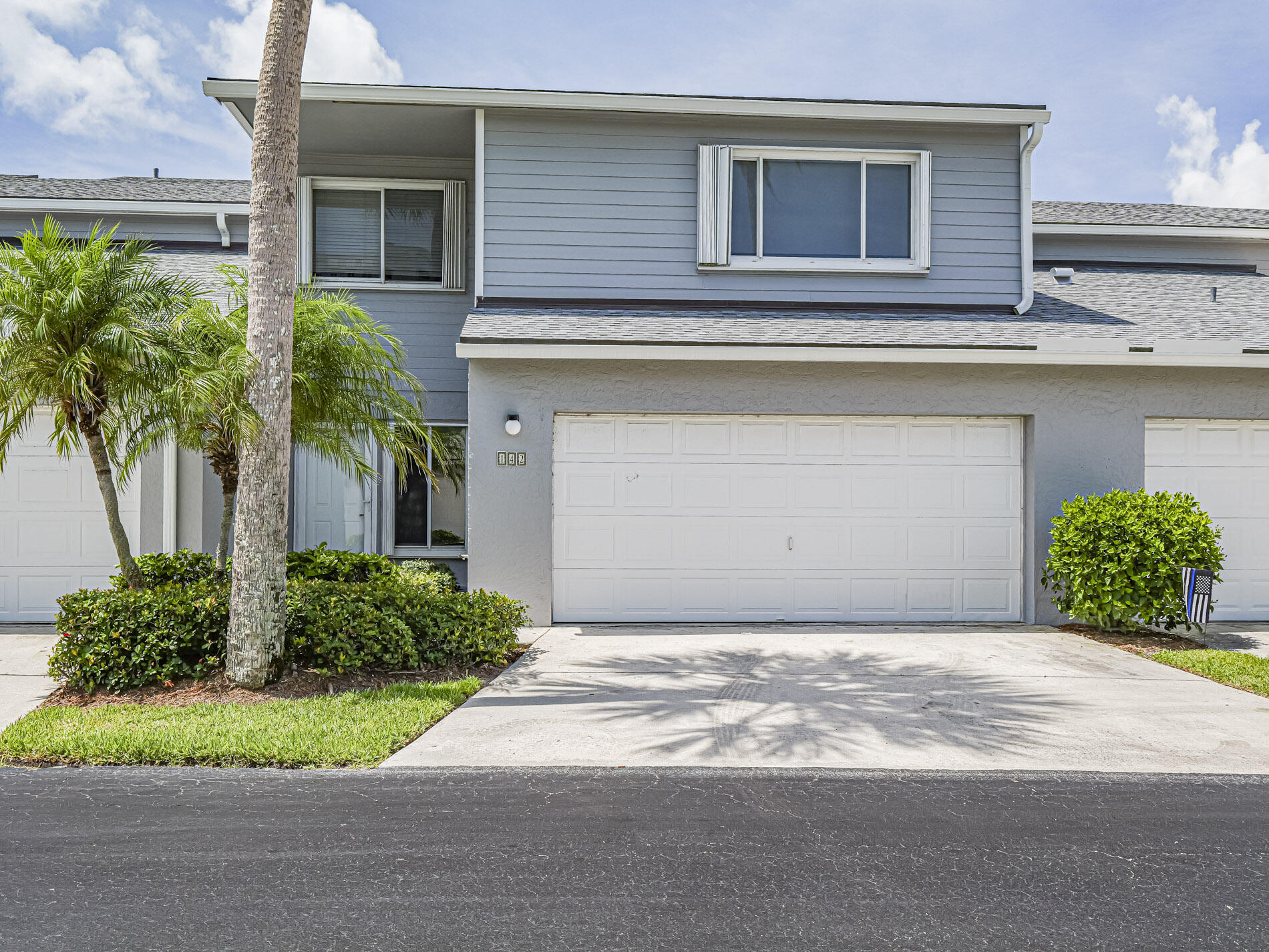 Are you dreaming of a beach house to call your own? This updated 3BR/2.5BA Townhouse offers over 2,100 sq ft of living space just steps from North Hutchinson's blue water beaches. Spacious kitchen & living/dining area leads to huge private screened patio. Upstairs the primary BR features remodeled en suite w walk in shower, garden tub & balcony overlooking preserve.  Two guest rooms, updated full BA & laundry complete the upstairs. Additional upgrades include new roof, exterior paint, skylights, new flooring, carpet, AC & Tesla charger in your 2 car garage. Community amenities include deeded beach access via a new ocean boardwalk, heated pool, tennis, pickleball, shuffleboard, sauna, fishing dock, clubhouse, and nature trails adjacent to Queens Island Preserve.