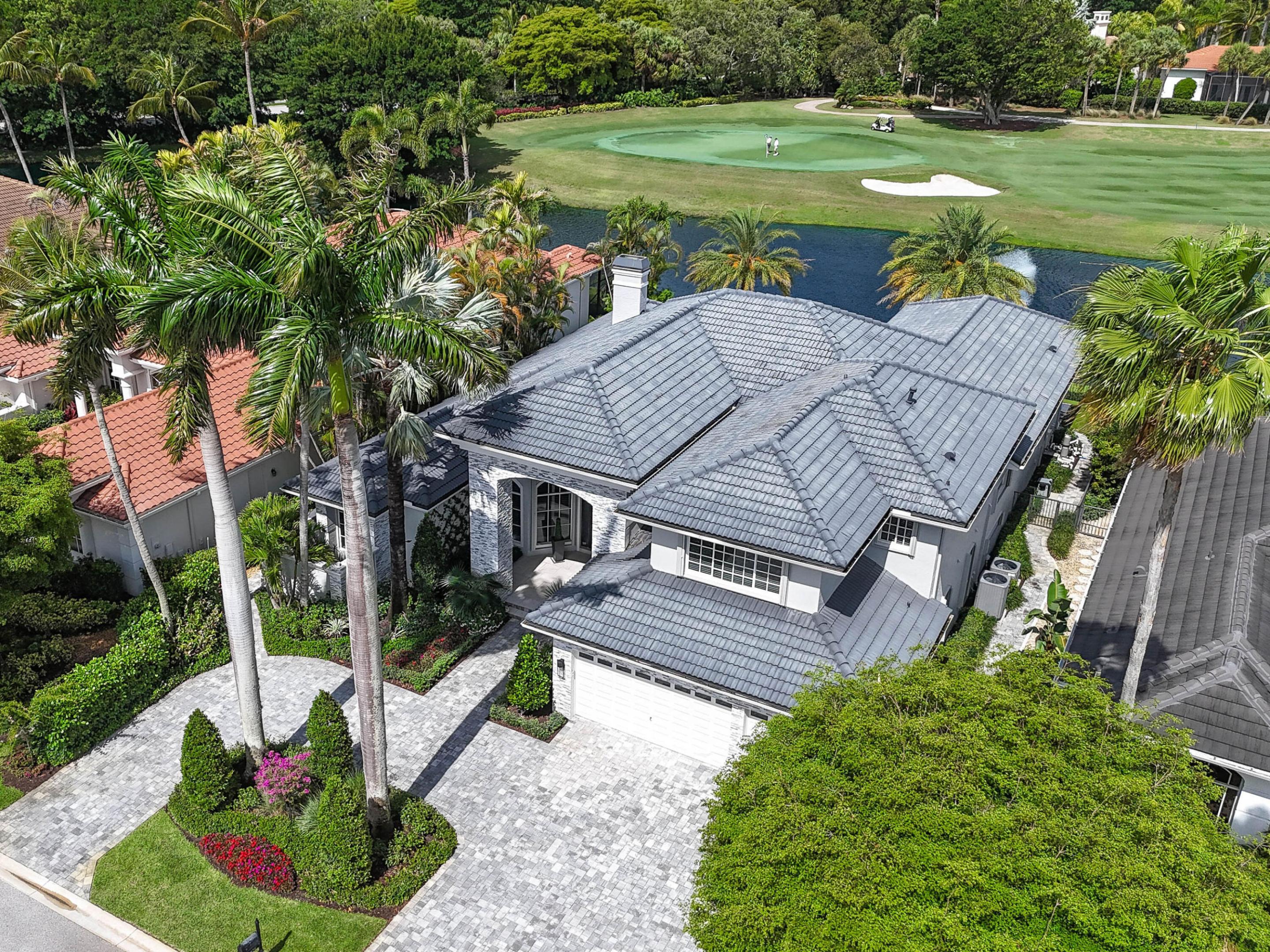 Updated luxury estate home showcasing panoramic golf & water views.  4 BD + Office, 5.5 BA, 3 CG, generous single-level living; the primary suite w/ his & her baths, additional bedroom, and a den/office all on the first floor.  The second floor has a loft area and 2 bedrooms with ensuite baths.  Volume ceilings, expansive windows and views, desirable flow and floor plan.  Outdoor living is a standout;  stunning pool, spa, covered lanai, and summer kitchen.  Exceptional views of the 8th green on the South Course.  Why wait? there's also a full golf membership.  Seller improvements in progress include installation of impact windows and doors, plus a complete renovation of the primary bath.