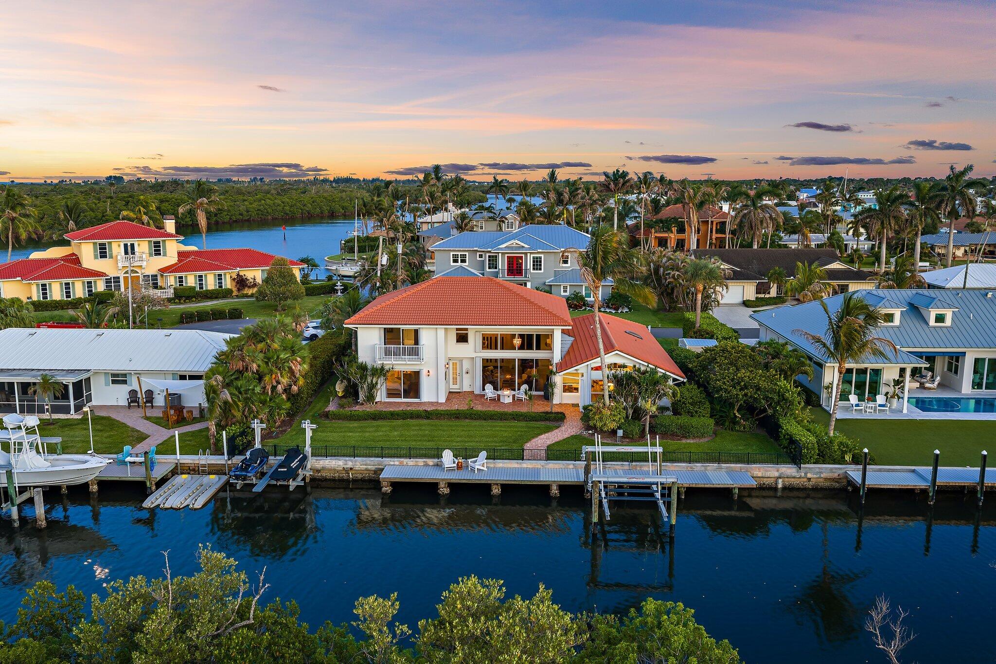 This beautifully remodeled 4-bedroom, 3-bath waterfront home is ideally located in Hobe Sound, just two homes from the Intracoastal Waterway. Offering 100 feet of waterfront frontage, this is one of the most private canal homes in the area, with a protected preserve directly behind the property creating a serene natural backdrop, unmatched privacy, & no rear neighbors. Designed with the boating lifestyle in mind, the recently replaced dock is equipped with a boat lift and two Jet Ski lifts, making it effortless to enjoy life on the water. The seawall has also been professionally raised by one foot, providing added protection and long-term value. Minutes from the Intracoastal Waterway, this exceptional waterfront property offers quick access for boating, fishing, & waterfront adventures.