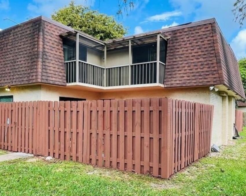 Super renovated unit. Renovated kitchen with stainless steel appliances. Renovated master bathroom with jacuzzi tub with jets. New modern toilets. New light fixtures. New laminate floors upstairs. Brand-new full-sized washer & dryer.  Impact windows and doors. Roof replaced in 2021. Fenced front yard area. Use showing online for appointment